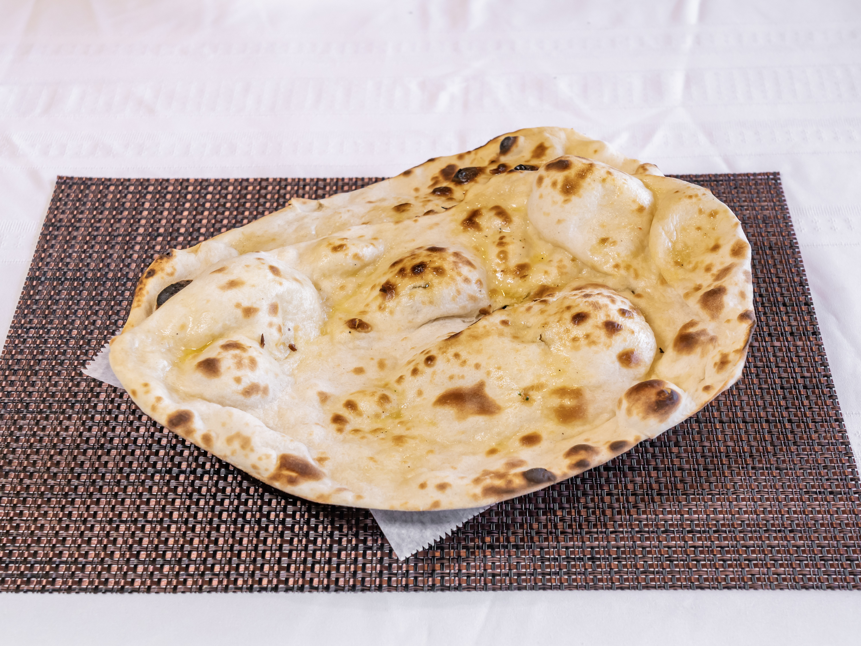 Order 91. Butter Naan food online from Charminar Biryani House store, Troy on bringmethat.com