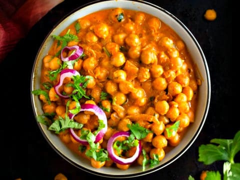 Order Channa butter masala food online from Cosmo Indian Cafe store, Lawrence on bringmethat.com