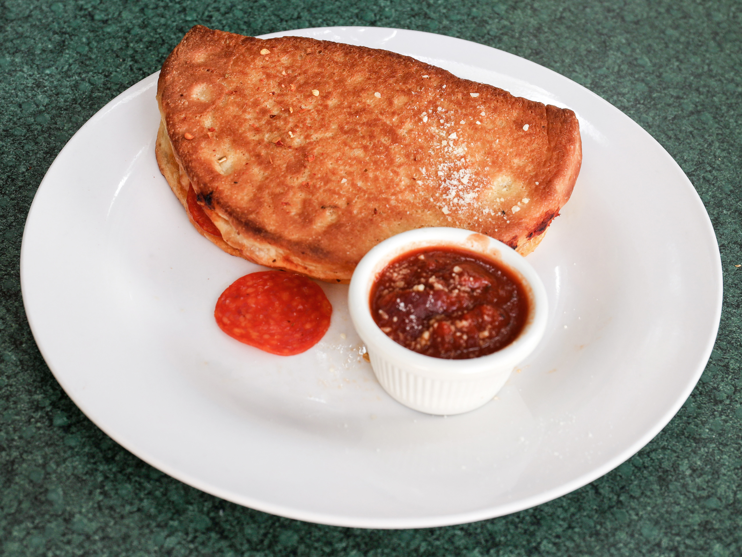 Order Calzone with 1 Ingredient food online from Numero Uno Pizza store, Santa Clarita on bringmethat.com