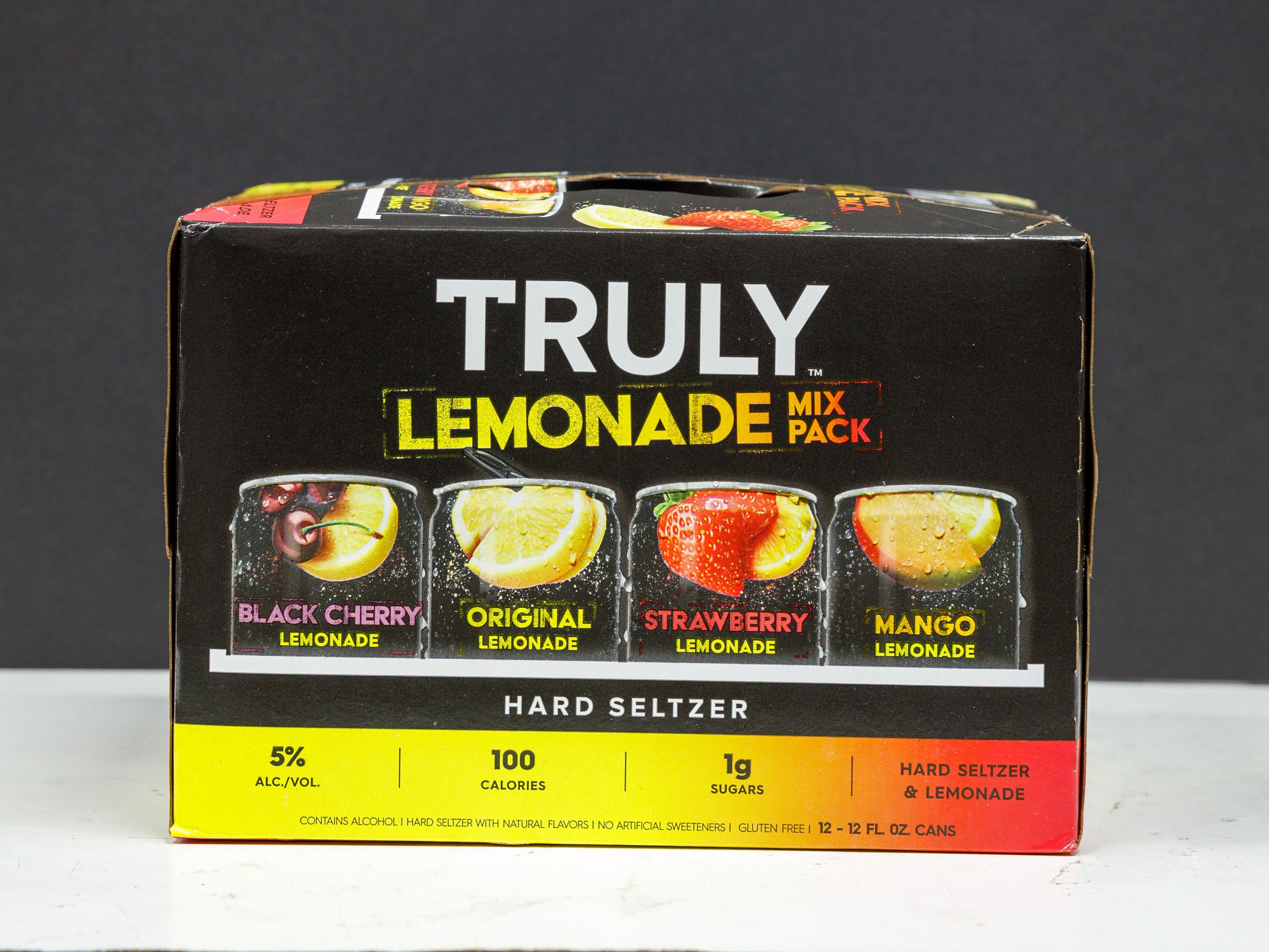 Order 12 Pack of 12 oz. Canned Truly Tropical hard Seltzer Mix  Pack Spiked & Sparkling Water food online from Liquor Deli store, La Puente on bringmethat.com