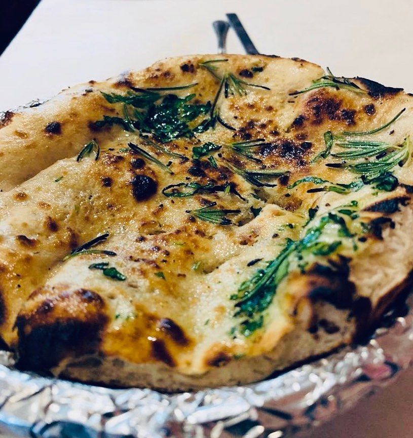Order Rosemary Naan food online from Star of India Restaurant store, Little Rock on bringmethat.com