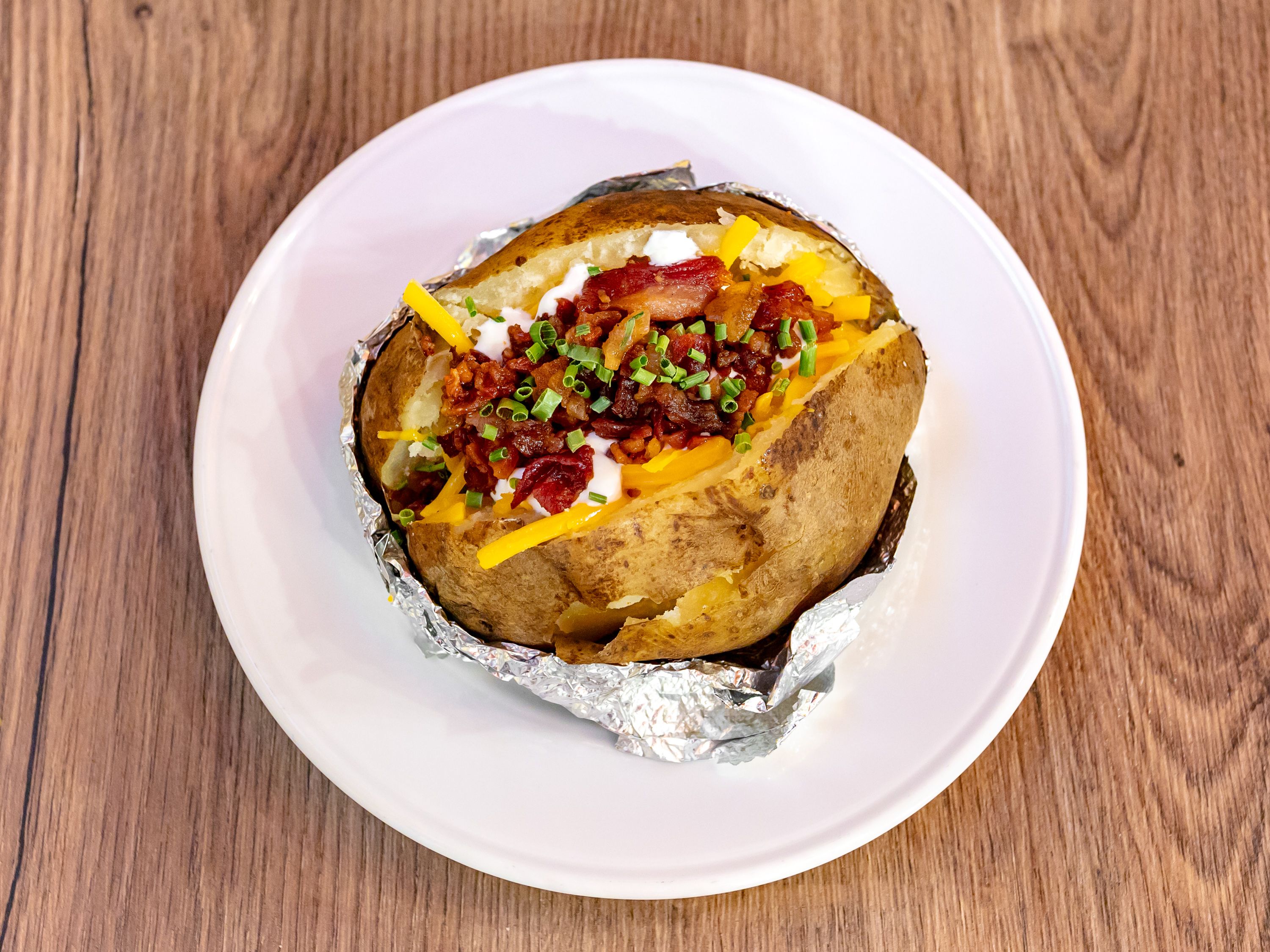 Order Loaded Baked Potato food online from Home Town Steak & Que store, Euharlee on bringmethat.com