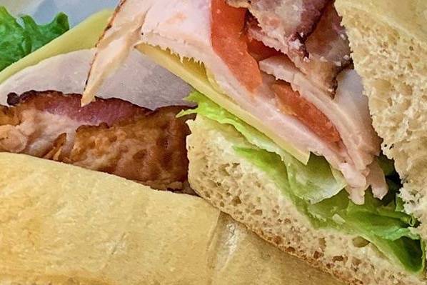 Order Turkey Club Panini food online from L'Artisan Cafe &amp; Bakery store, Providence on bringmethat.com