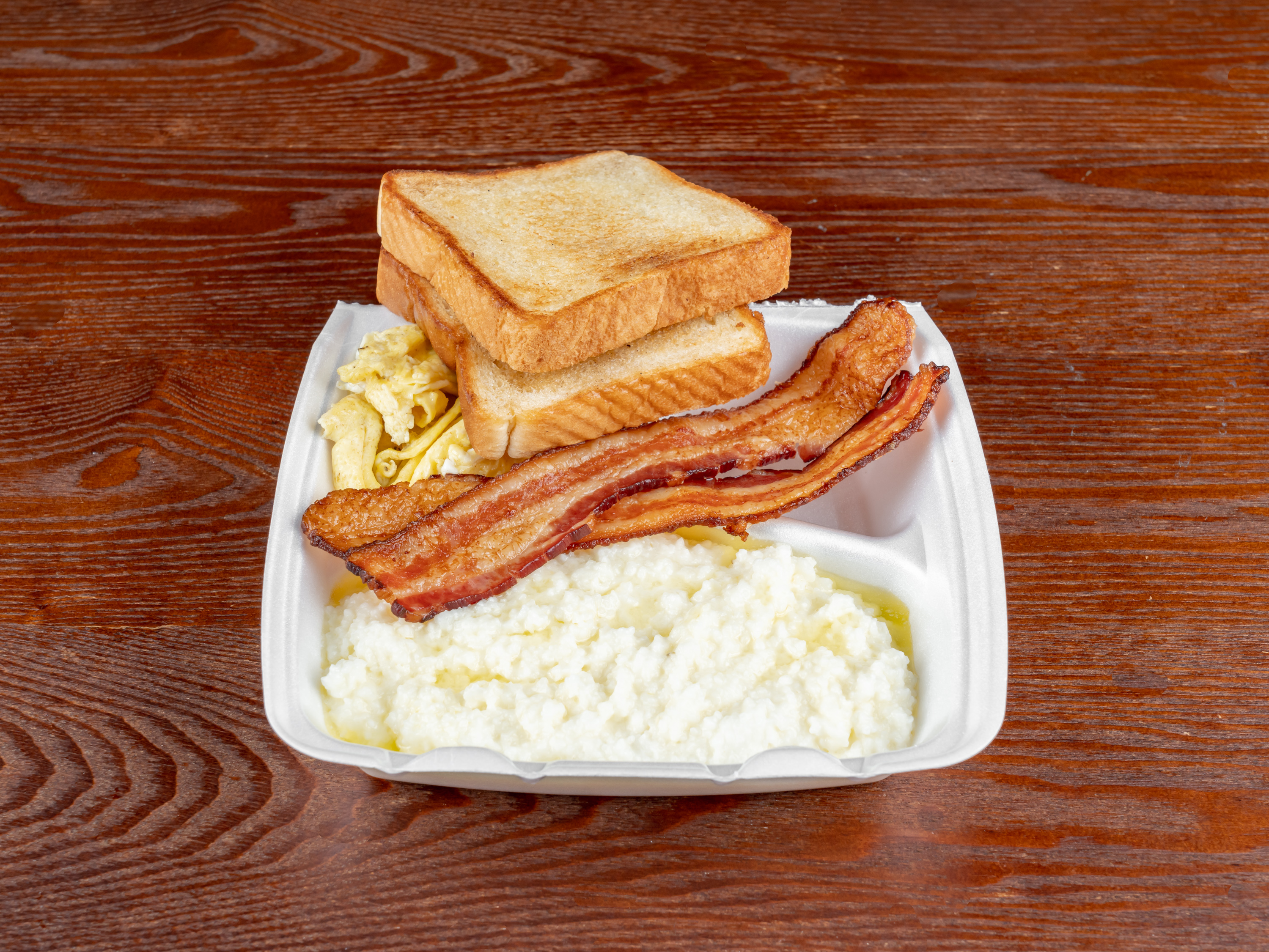 Order 2 Buttered Toast, Grits, 2 Eggs and 2 Bacon food online from Meraki Kitchen store, Houston on bringmethat.com