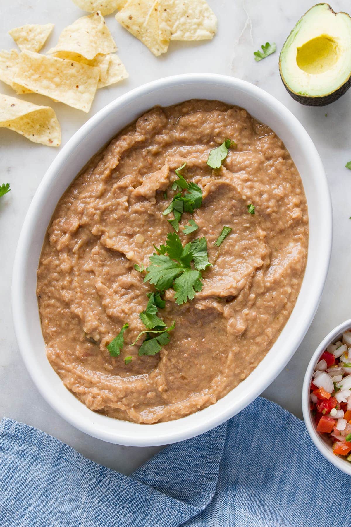 Order SMALL DEEP TRAY OF REFRIED BEANS (SERVES APPX. 25-35 PEOPLE) food online from La Mejor store, Farmersville on bringmethat.com