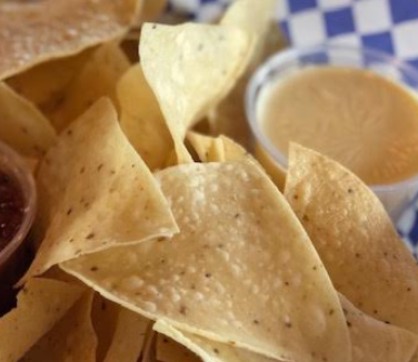 Order Tortilla Chips and Queso food online from TnT Wings store, Omaha on bringmethat.com