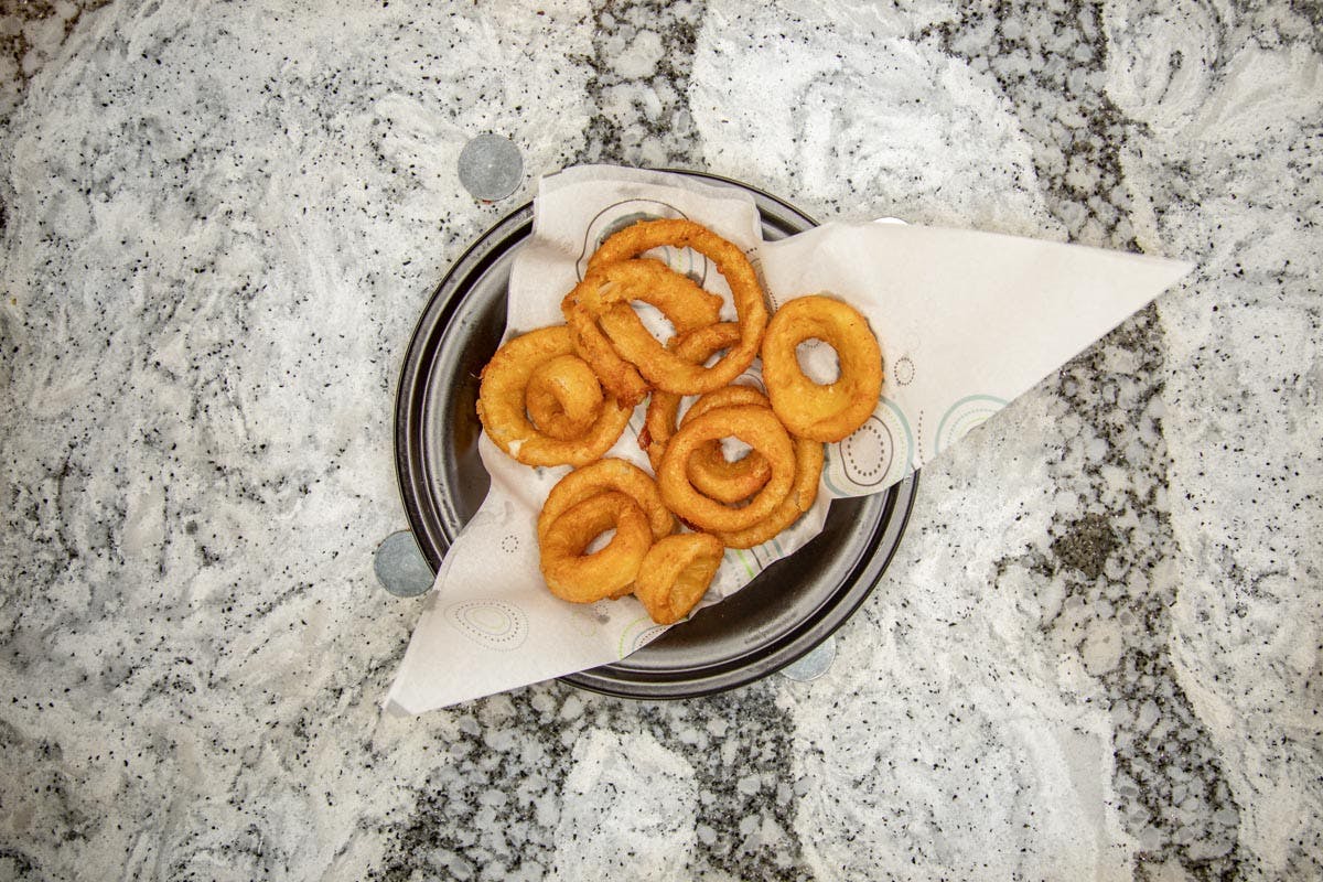 Order Beer Battered Onion Rings - Appetizer food online from Topshelf Pizza & Pub store, Muskegon on bringmethat.com