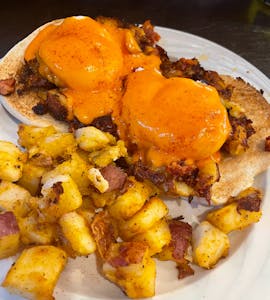 Order Portuguese Benedict food online from Rachel's Cafe store, Wakefield on bringmethat.com