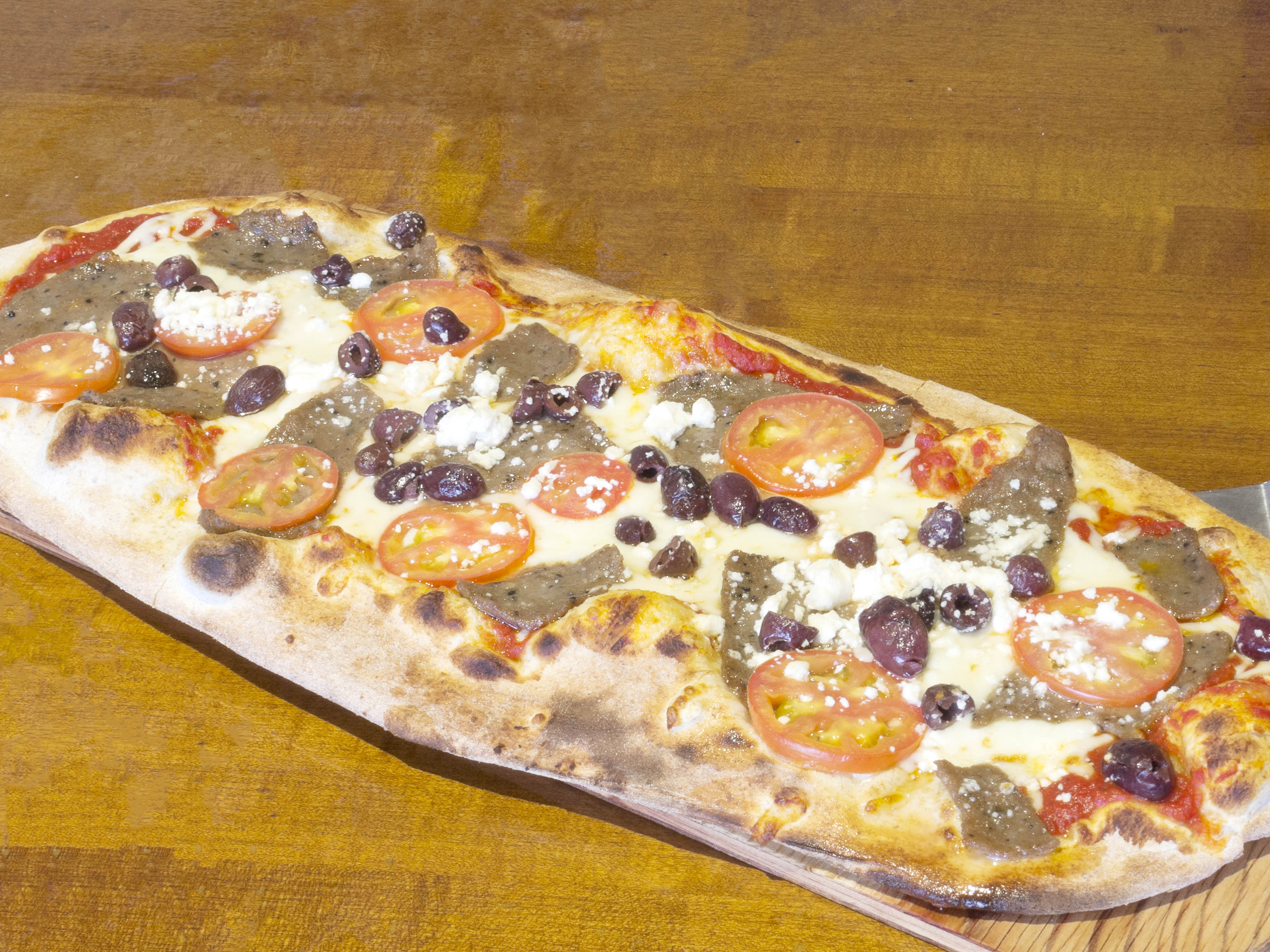 Order The Greek Pizza food online from Byblos Mediterranean Lebanese Restaurant store, Fort Worth on bringmethat.com
