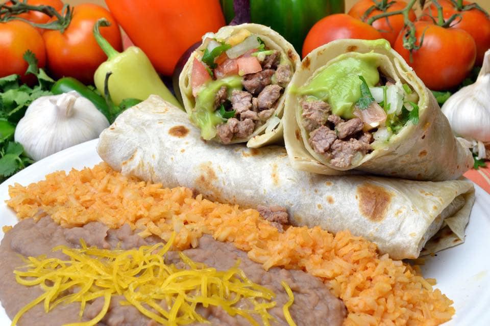 Order 18. Two Carne Asada Burritos food online from Los Cuates store, Raleigh on bringmethat.com