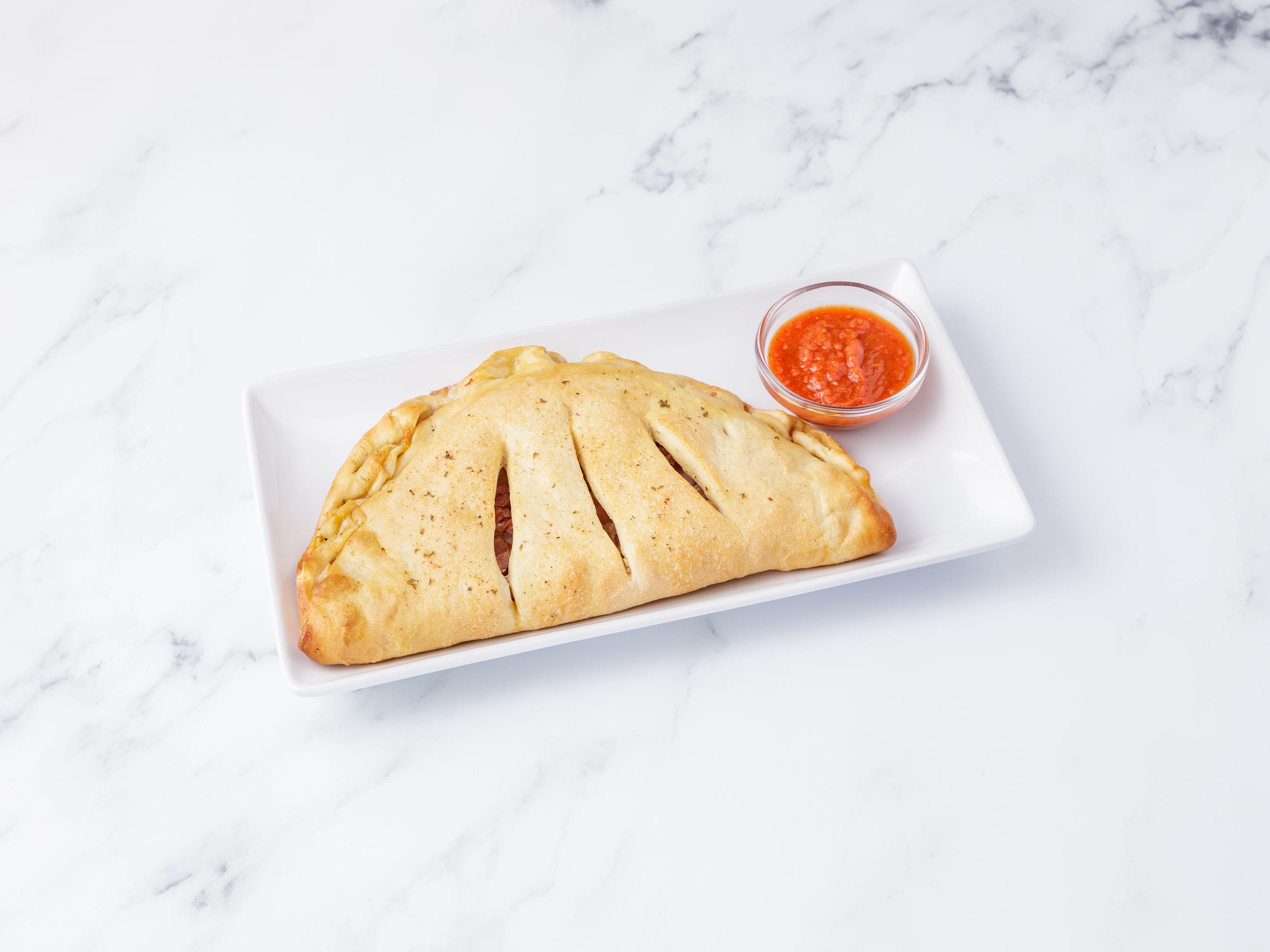 Order Meat Lovers Calzone food online from Mac Pizzeria & Catering store, Rochester on bringmethat.com
