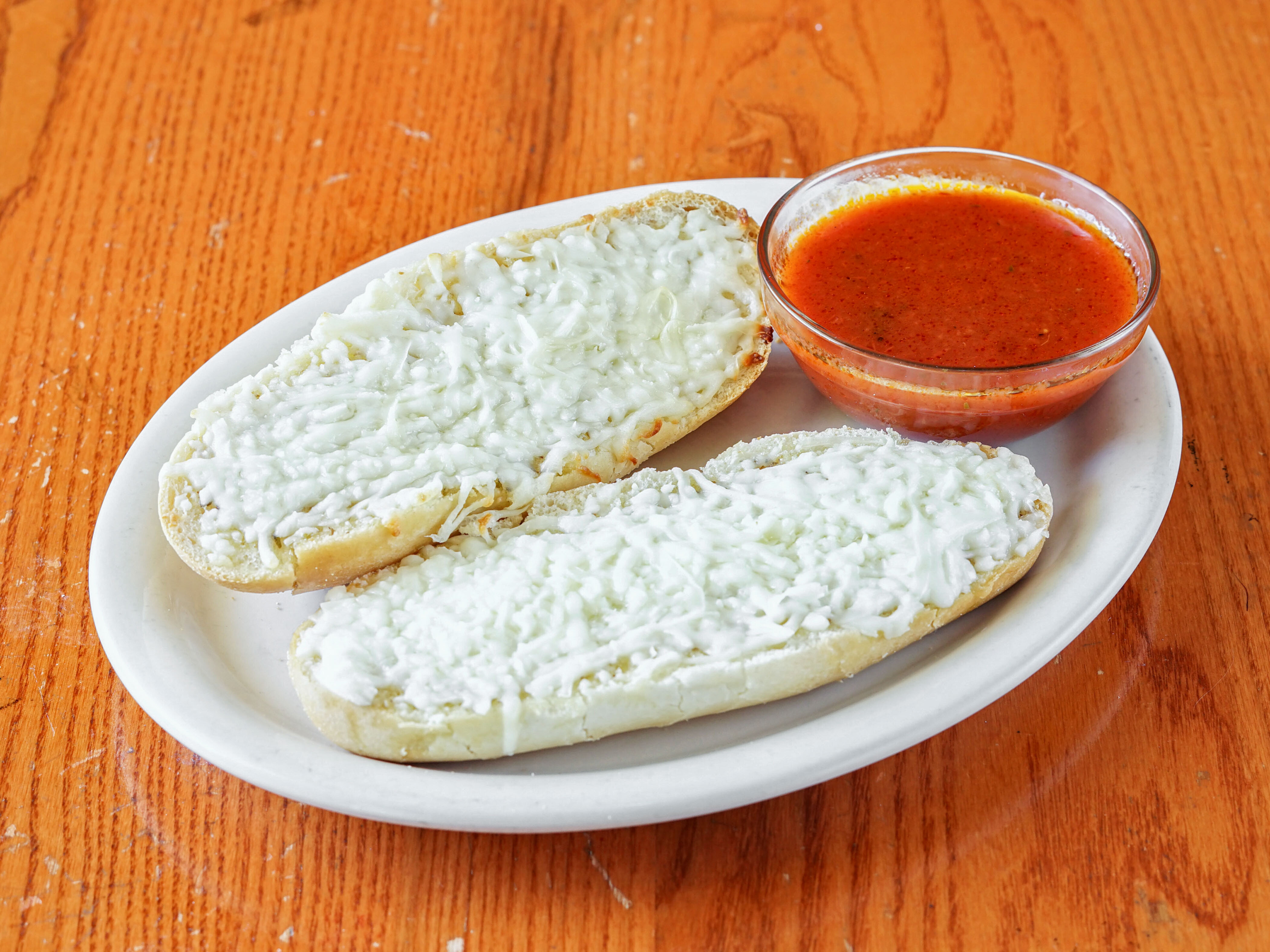 Order Garlic Bread with Cheese and Marinara Sauce food online from Martellucci Pizzeria store, Bethlehem on bringmethat.com