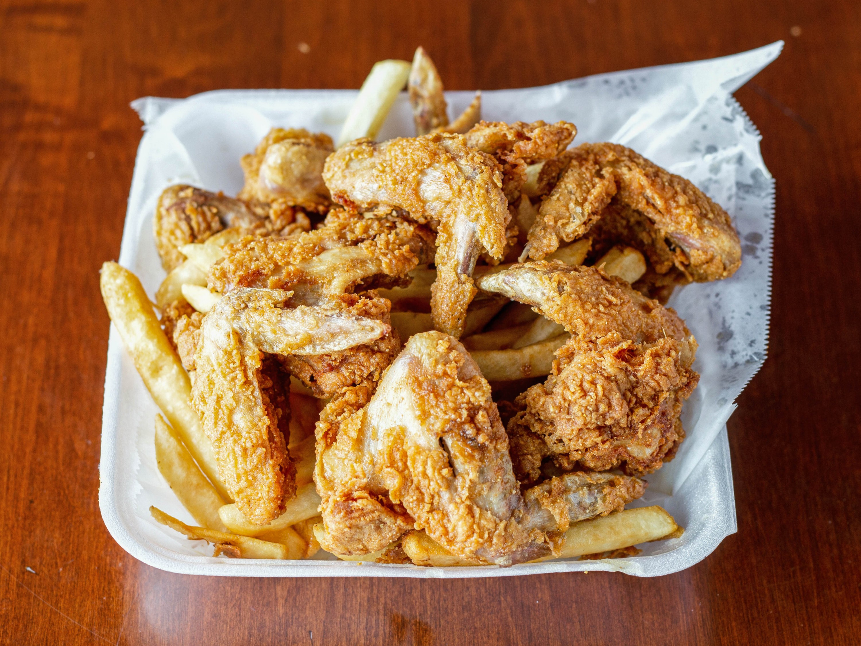 Order Wings Combo food online from Kingdom Restaurant store, Madison on bringmethat.com