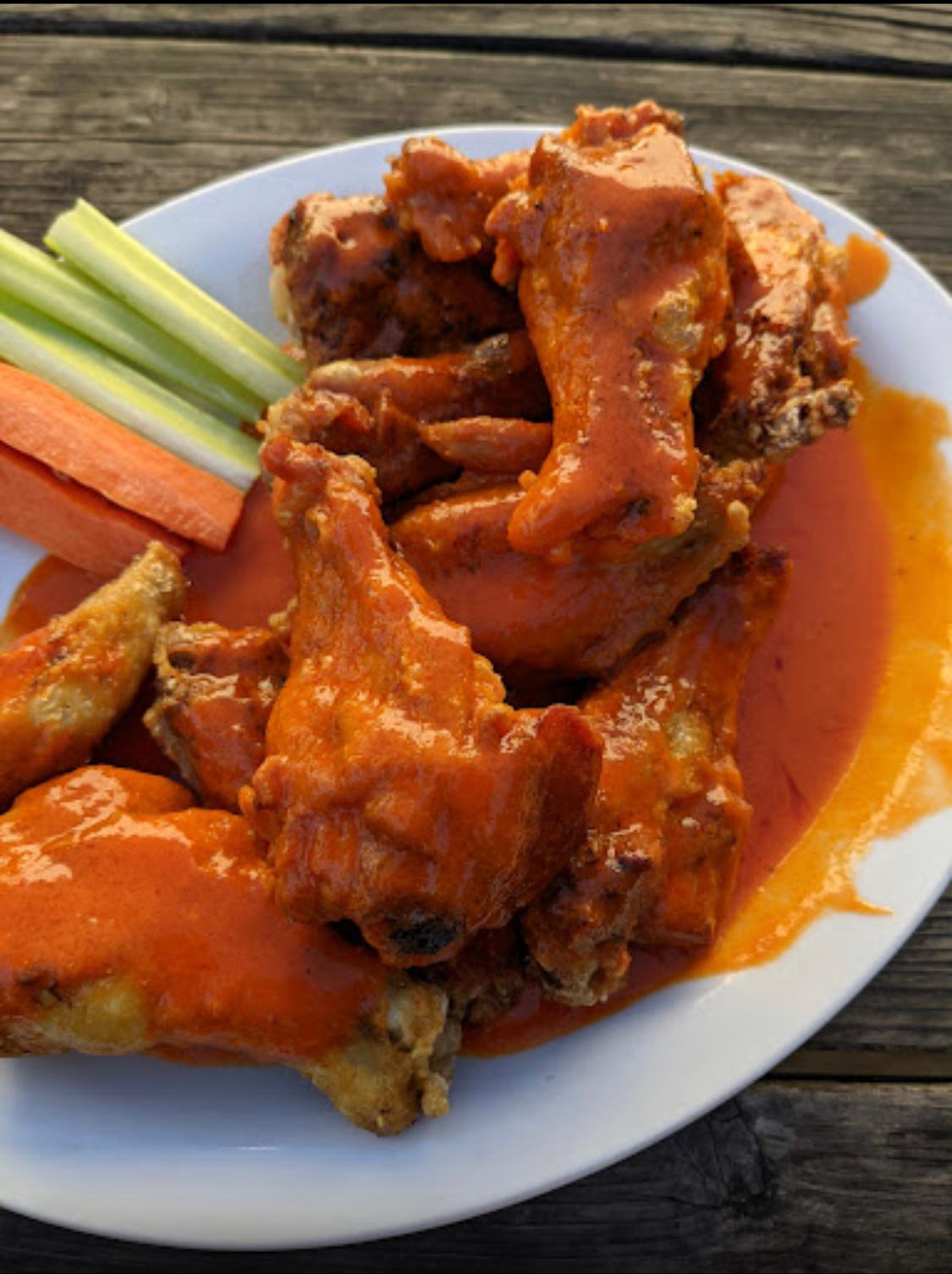 Order Doz Buffalo Wings food online from Pizza Place On Noriega store, San Francisco on bringmethat.com