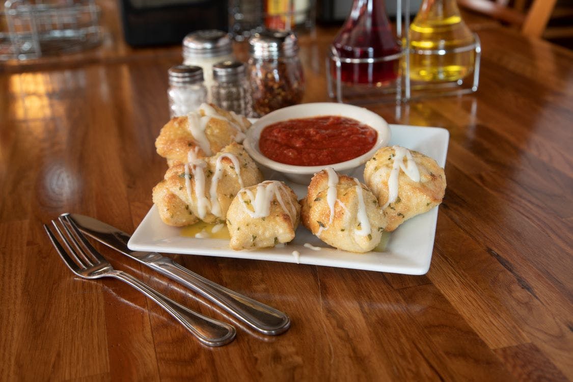 Order Garlic Naughty Knots - 6 pieces food online from Barb's Pizza store, Cromwell on bringmethat.com