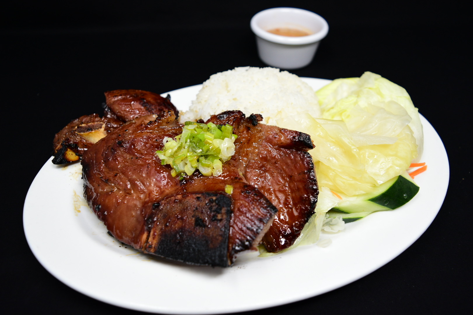 Order 62. Com Suon Nuong/Flame Broiled Pork Chop food online from Fortune Star Cuisine store, Reno on bringmethat.com