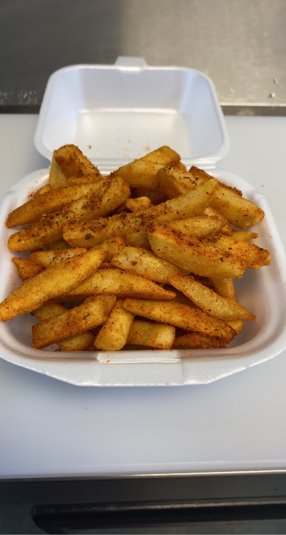 Order Cajun Fries food online from Houston Hot Wings store, Stafford on bringmethat.com