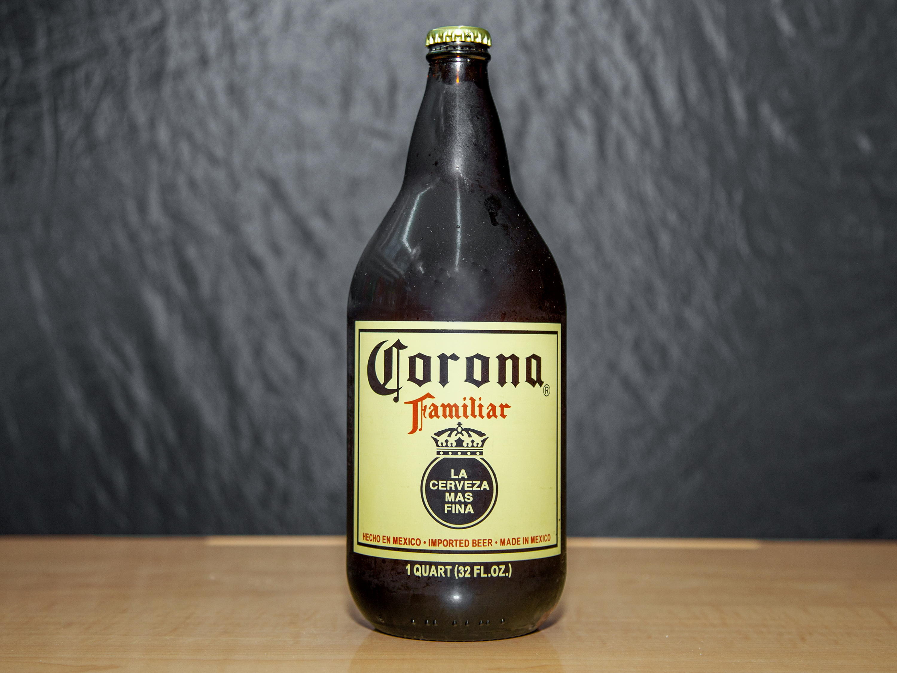 Order Corona Familiar, 32 oz. Bottle Beer (4.8% ABV) food online from Platinum Star Food & Liquor store, Chicago on bringmethat.com