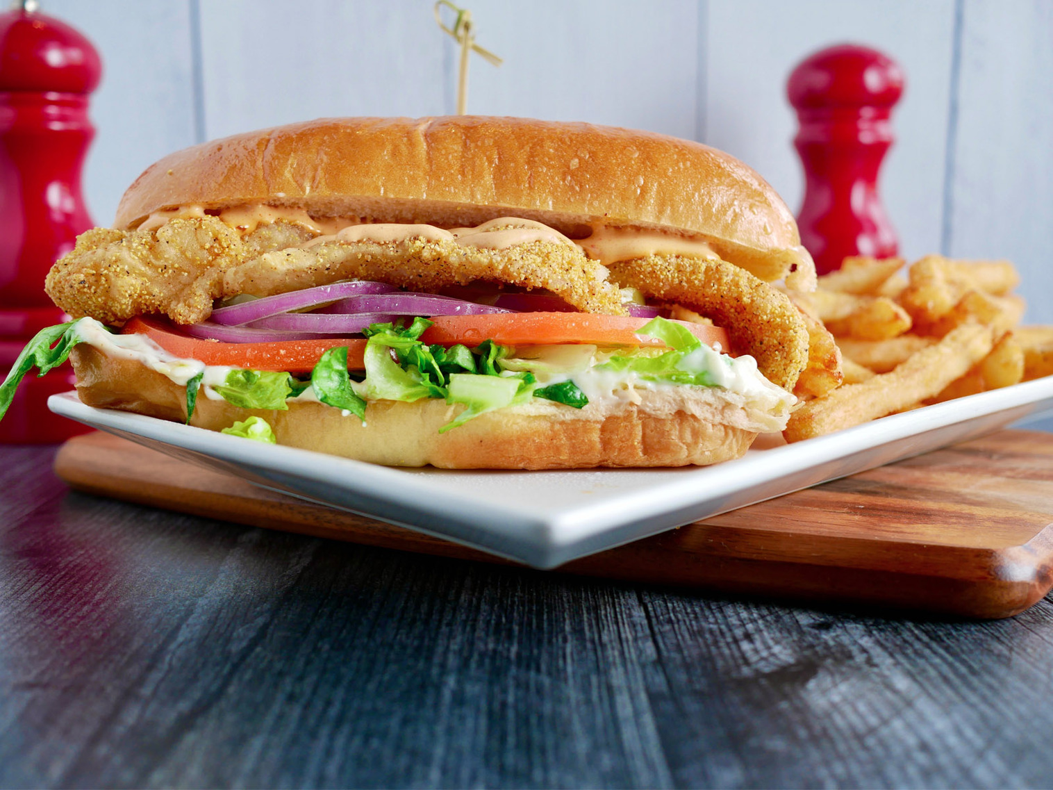 Order Po' Boy Sandwich Fish food online from Kocky Bar & Grill store, Fresno on bringmethat.com