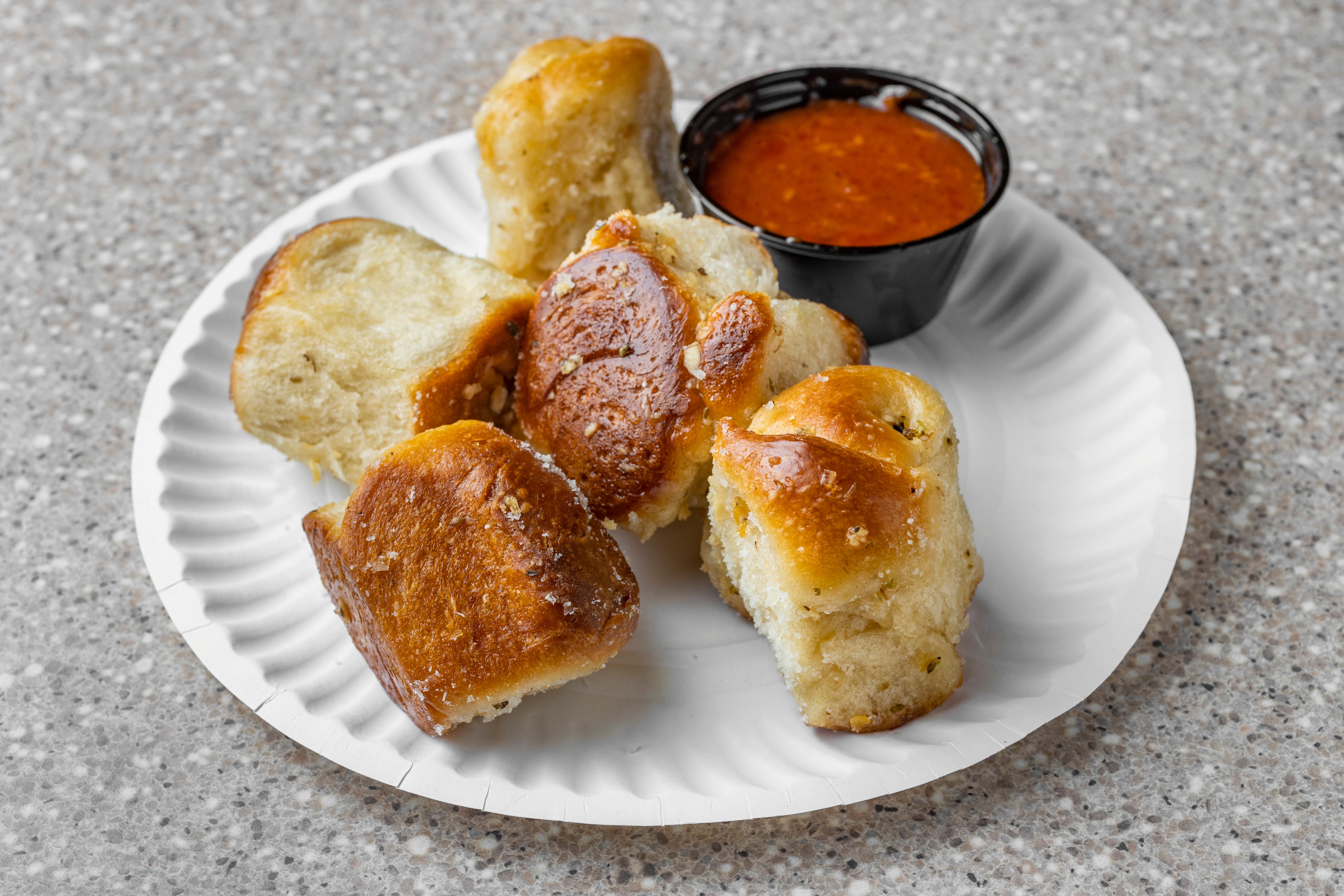 Order Garlic Knots - 6 Pieces food online from Campus pizza & gyro store, Hempstead on bringmethat.com