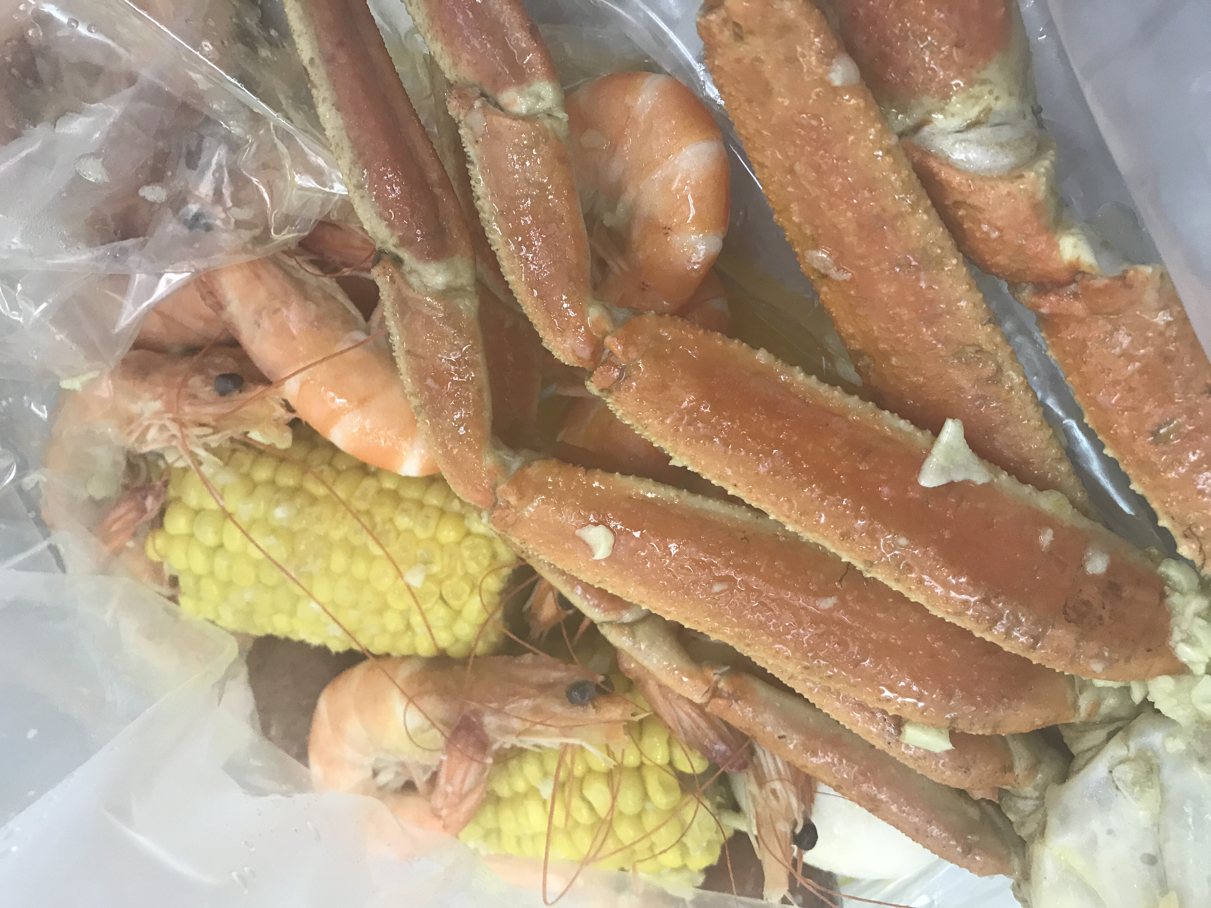 Order C. 1/2 lb. Snow Crab and 1/2 lb. Shrimp (Head on) Combo food online from Tasty Crab store, Fayetteville on bringmethat.com