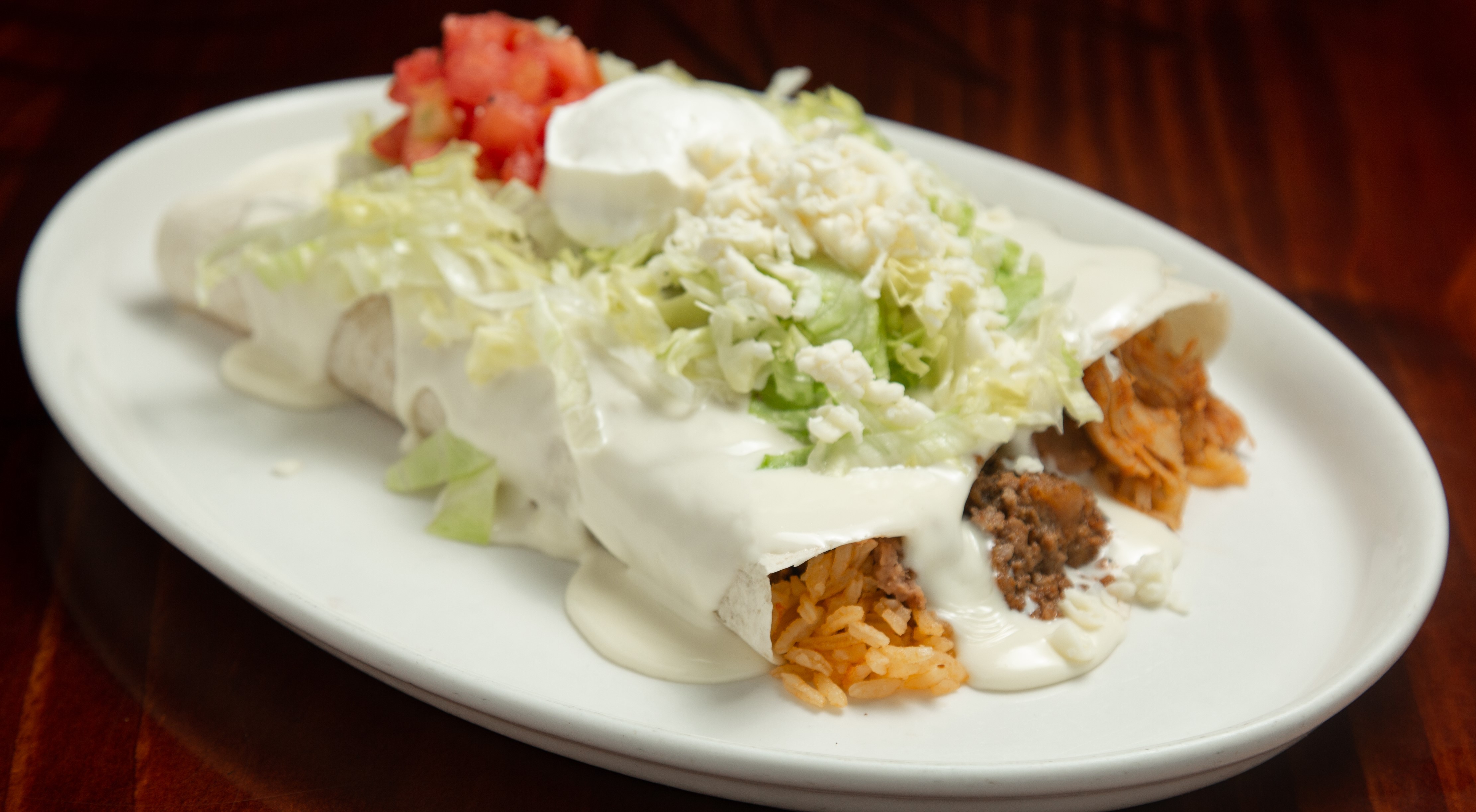 Order Burritos Deluxe Dinner food online from Pueblo Real store, Franklin on bringmethat.com