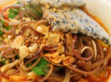 Order MI QUANG food online from District One Kitchen & Bar store, Las Vegas on bringmethat.com