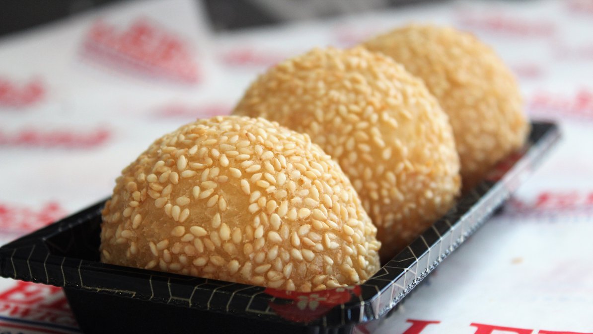 Order Sesame Ball Large 2pcs food online from Lee Sandwiches store, Artesia on bringmethat.com