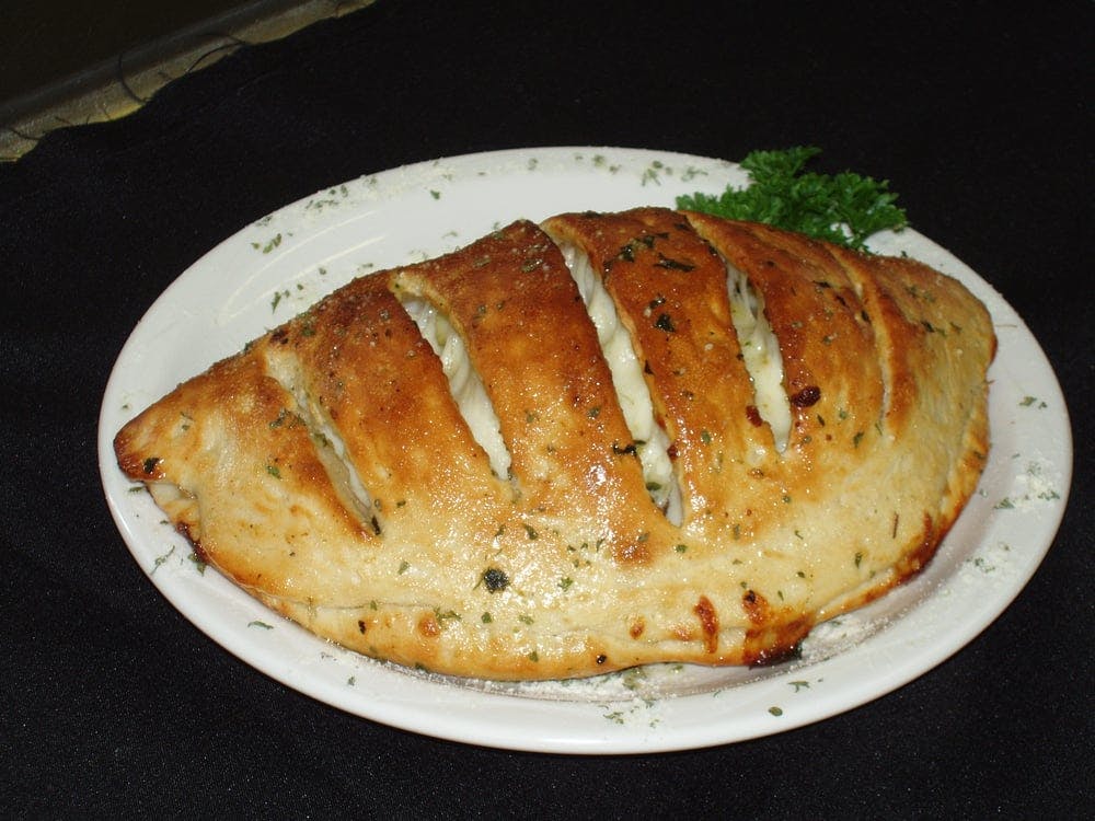 Order Italian Calzone - Calzone food online from Pizza Palace store, Burien on bringmethat.com