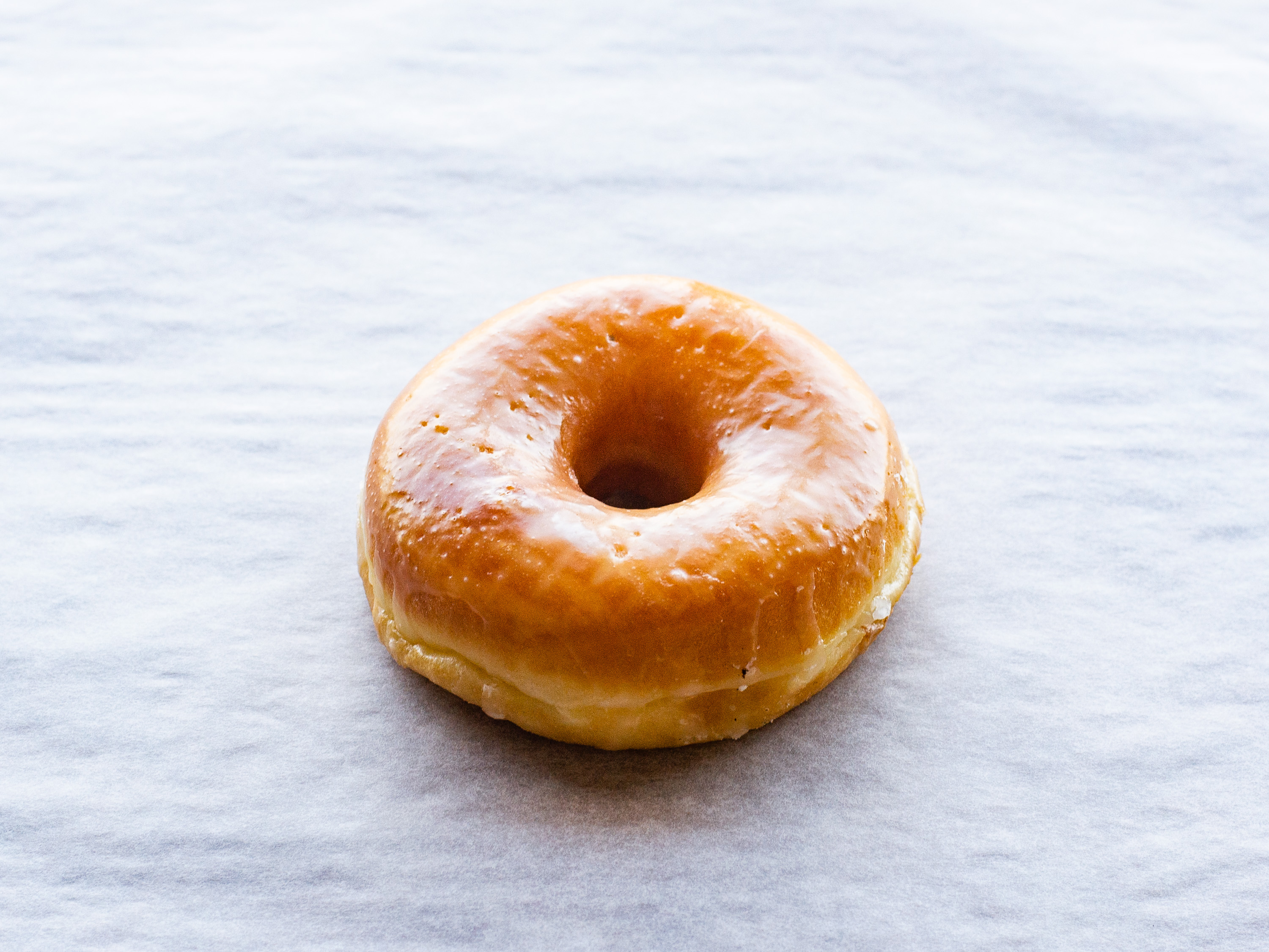 Order Glazed Icing Raised Doughnut food online from Donuts To Go store, Reedley on bringmethat.com