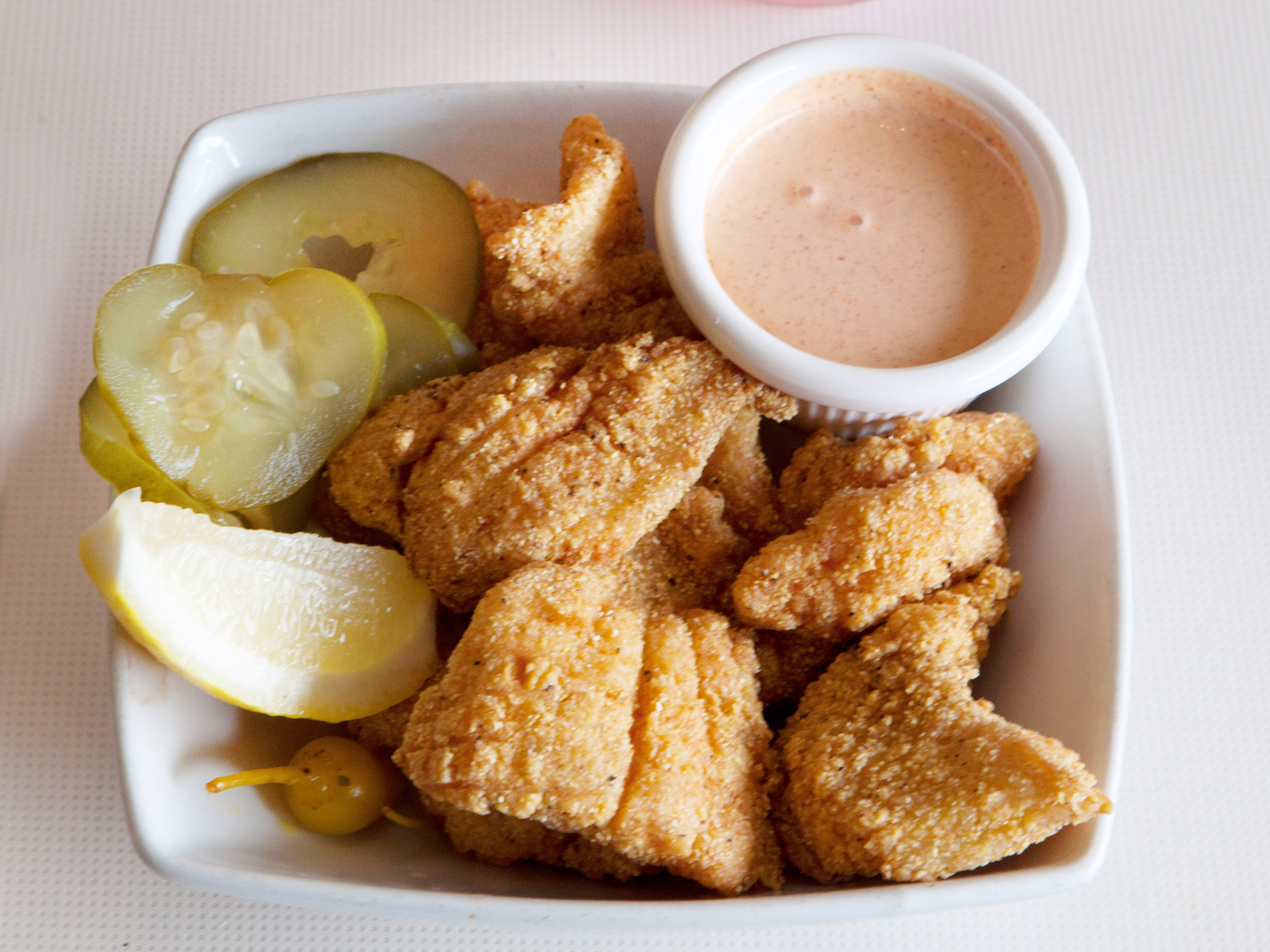 Order Catfish Nuggets w/ Fries food online from Stevie Creole Cafe store, Los Angeles on bringmethat.com