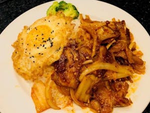 Order 136. Korean Kimchi & Pork Over Rice 韩式辣炒猪肉盖饭 food online from Jade Garden store, Lawrence on bringmethat.com