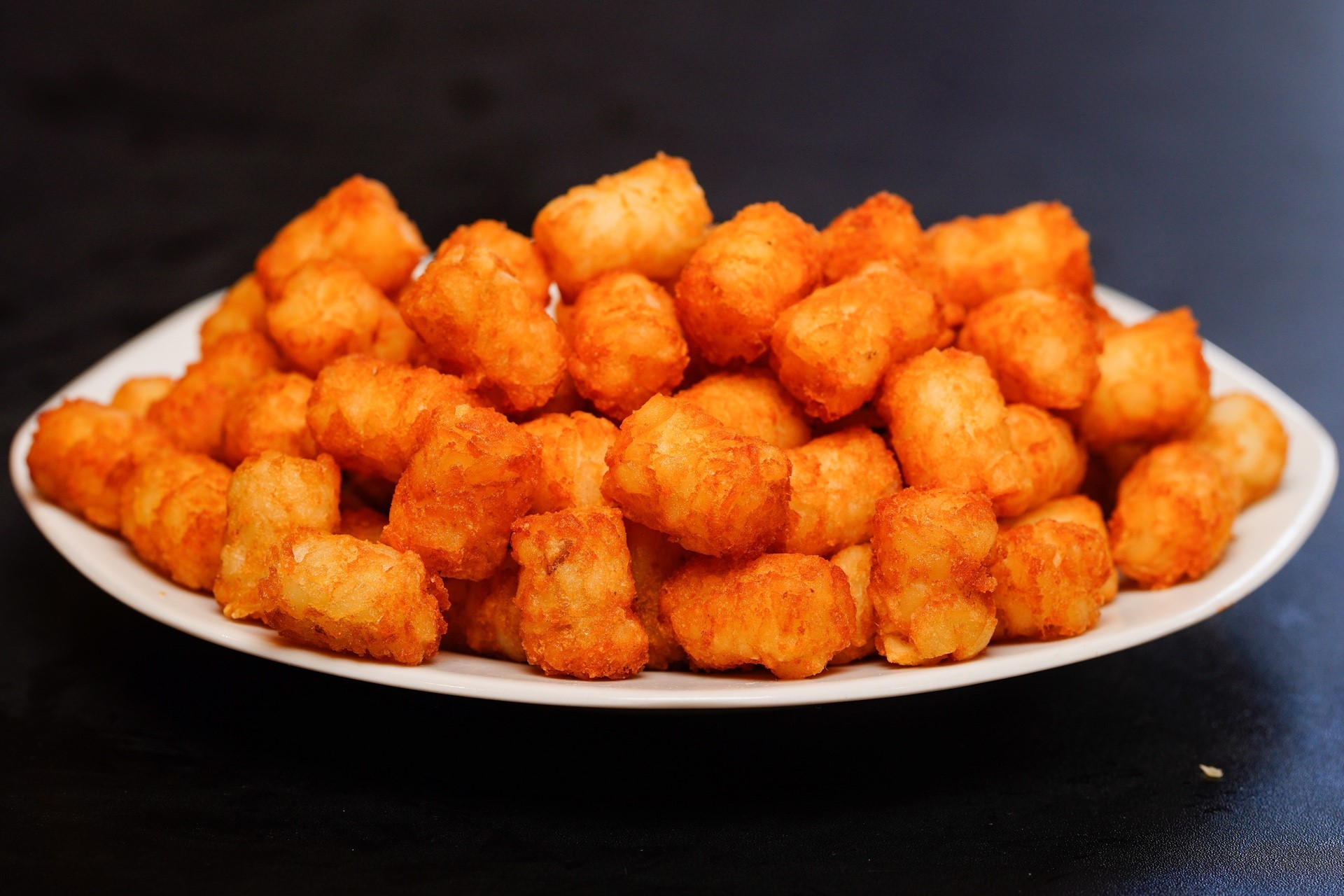 Order Tater Tots food online from Wings Over Fort Worth store, White Settlement on bringmethat.com