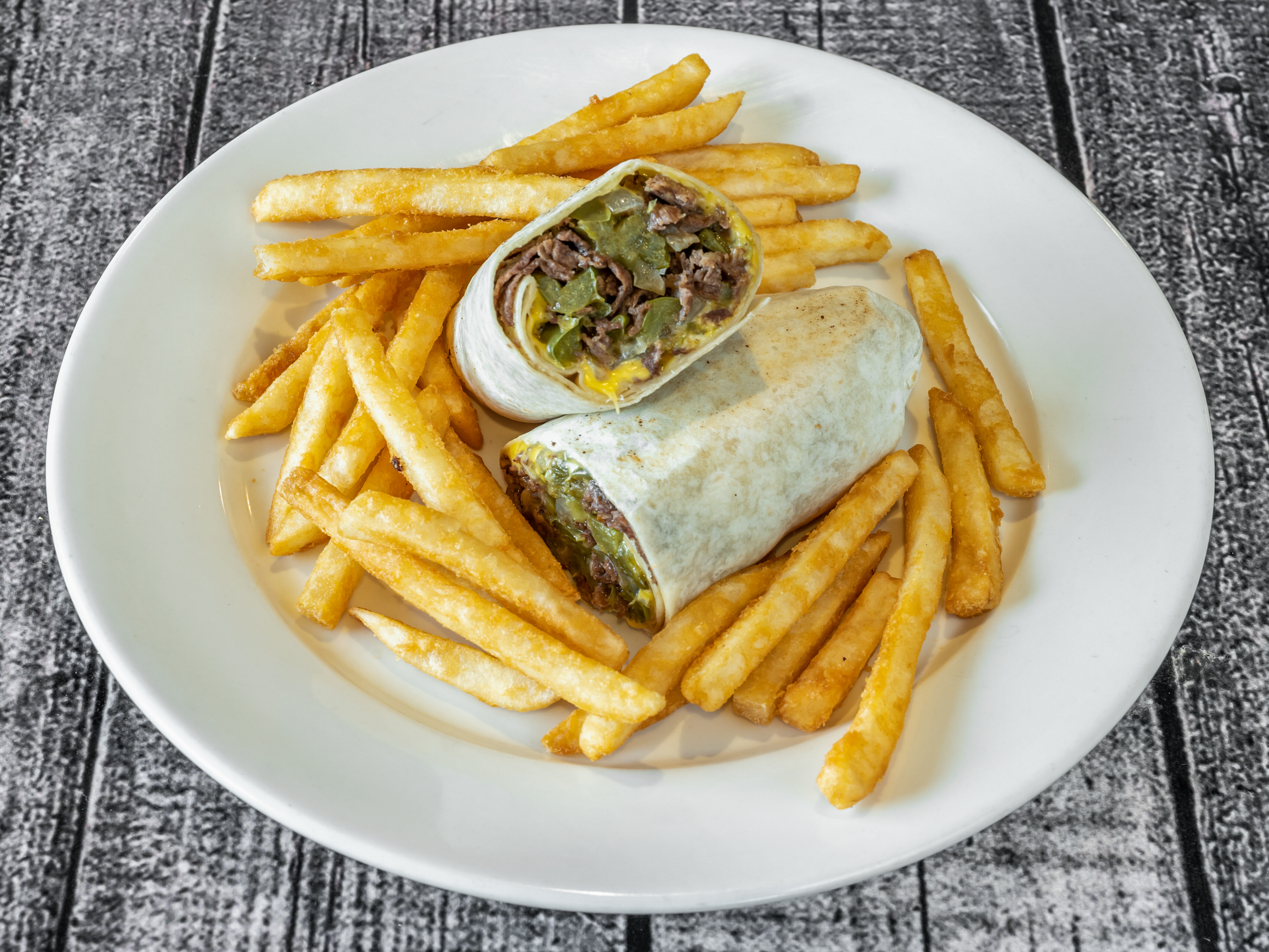 Order Philly Cheese Steak Wrap food online from Maria's Pizzeria & Restaurant store, Wharton on bringmethat.com
