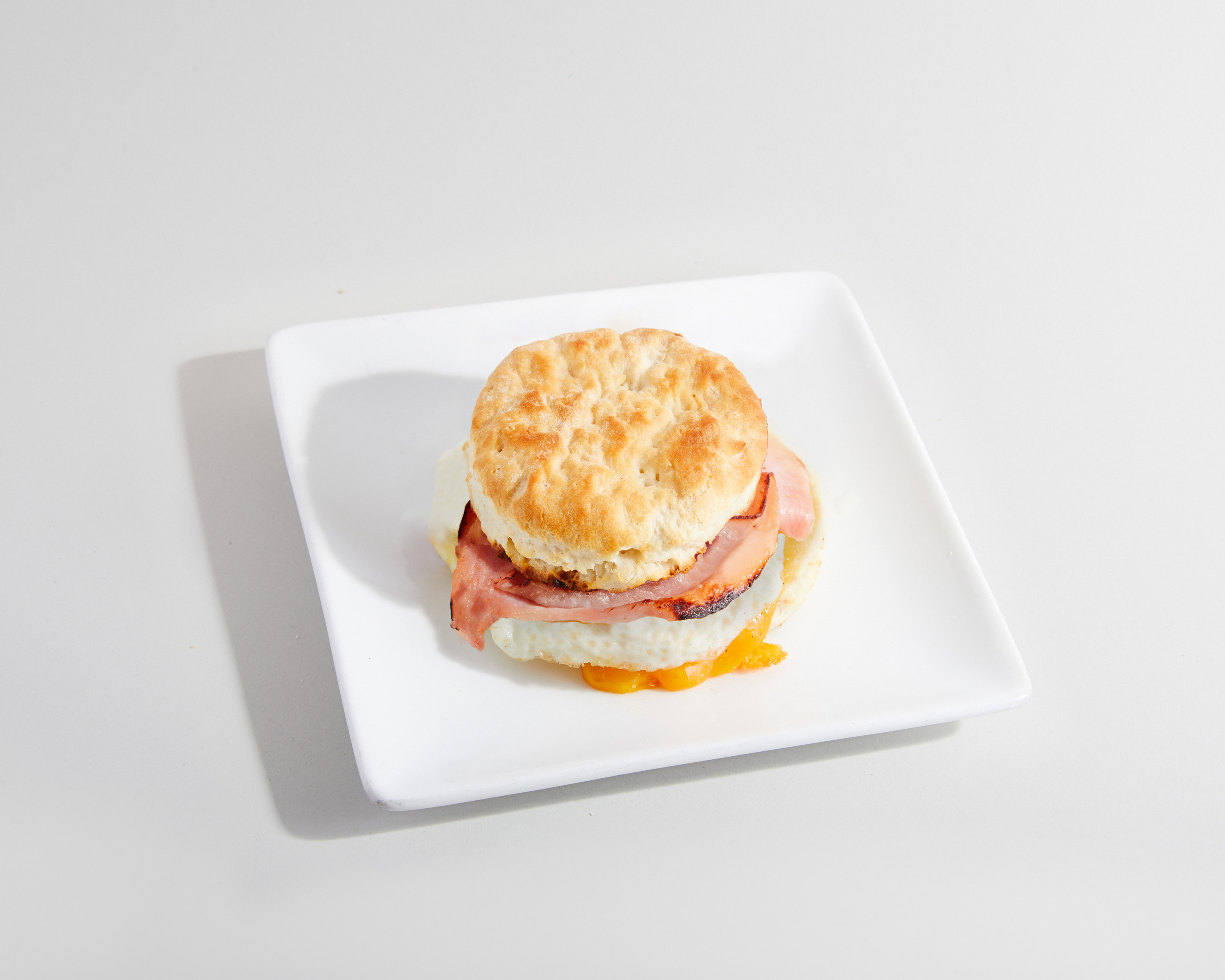 Order Biscuit sandwich - ham, egg & cheese  food online from Sweetwaters Coffee & Tea store, Asbury Park on bringmethat.com