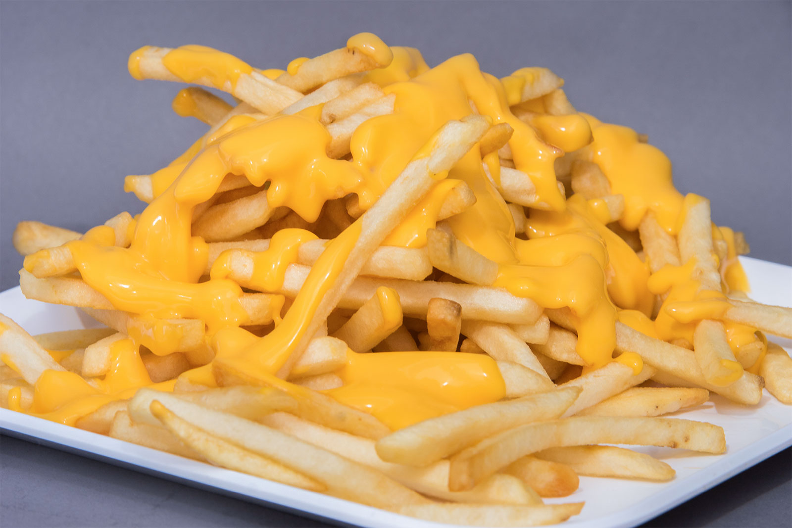Order 23. Fries with Nacho Cheese food online from Halal Indo - Mediterranean Food Truck store, Austin on bringmethat.com