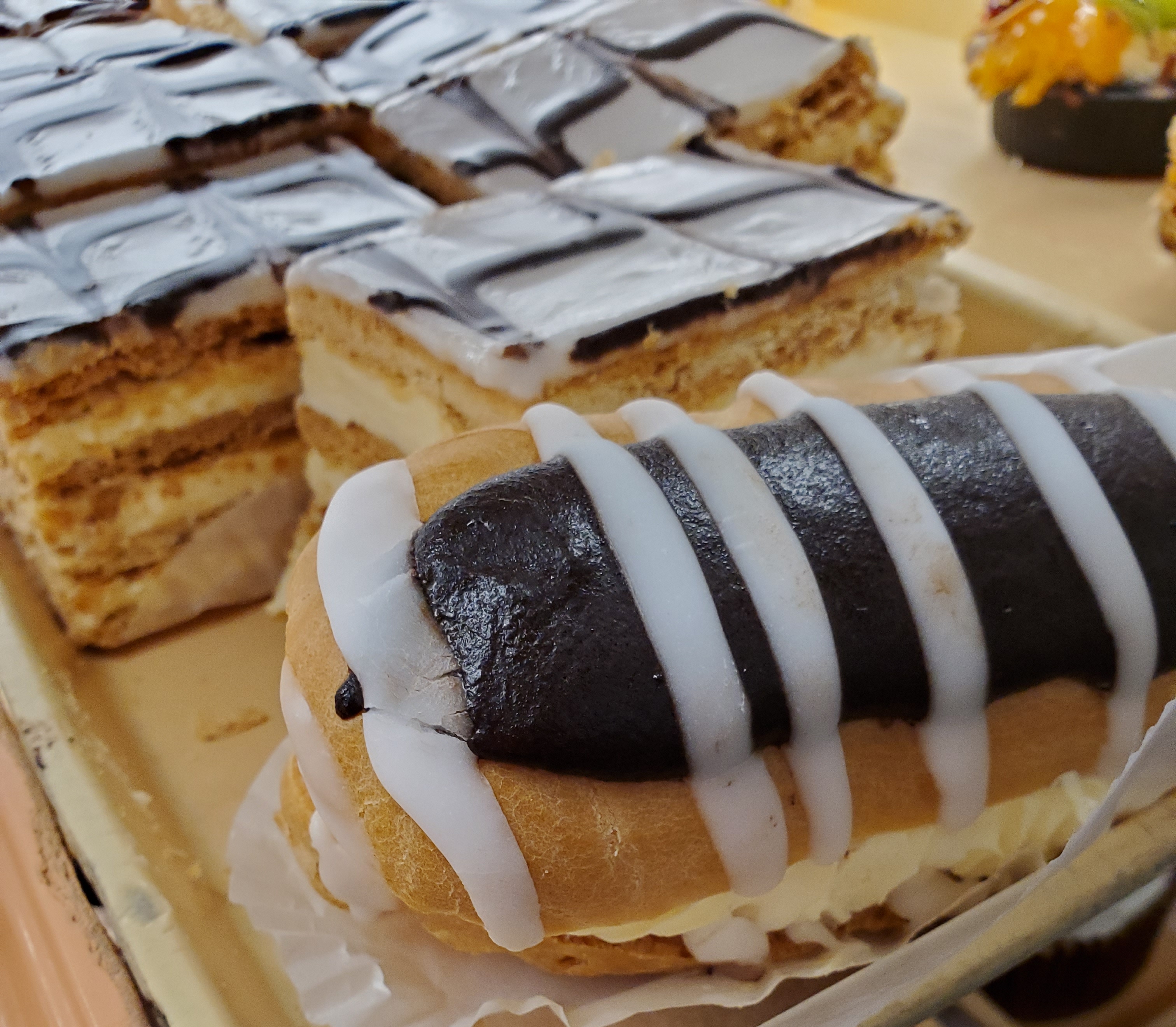 Order 2 Piece Eclair and 2 Piece Napoleon food online from Heidelberg Pastry Shoppe store, Arlington on bringmethat.com