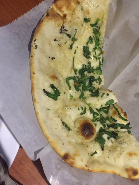 Order Garlic Naan food online from Spice Fine Indian Cuisine store, Austin on bringmethat.com