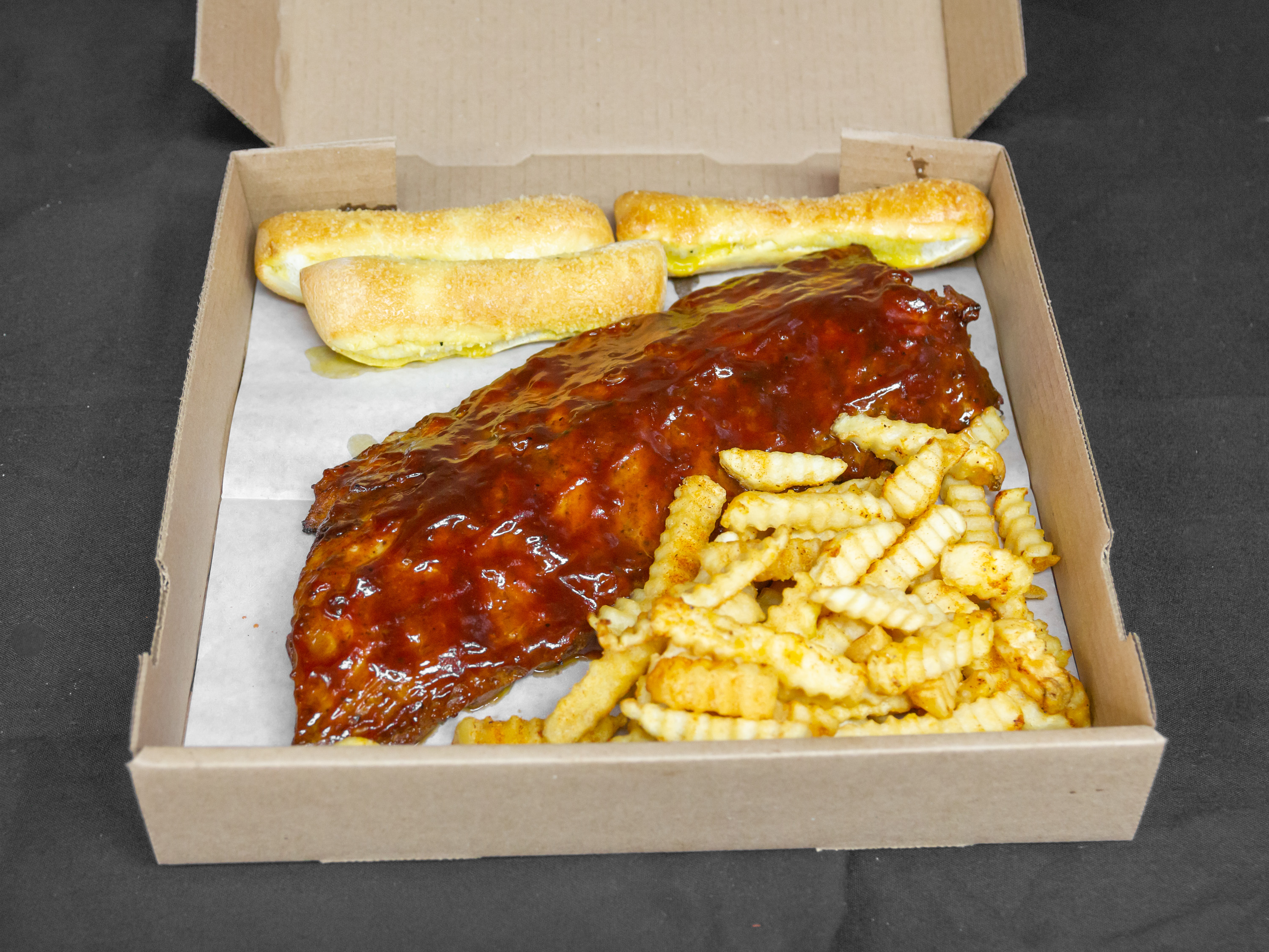 Order 1 lb. of BBQ Rib Tips food online from Fire Pizza store, Detroit on bringmethat.com