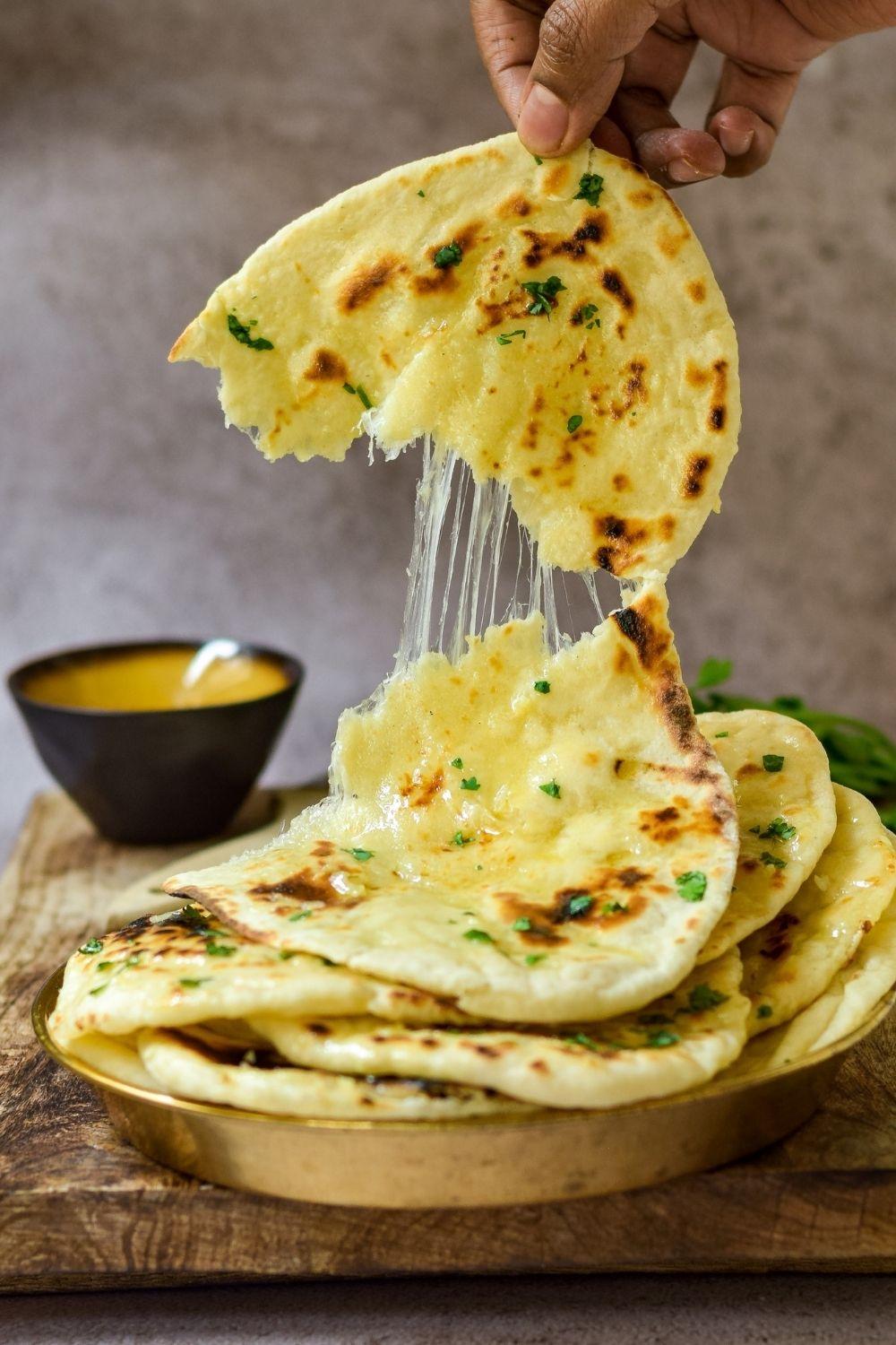 Order Cheese Naan food online from 5th Element store, Jacksonville on bringmethat.com