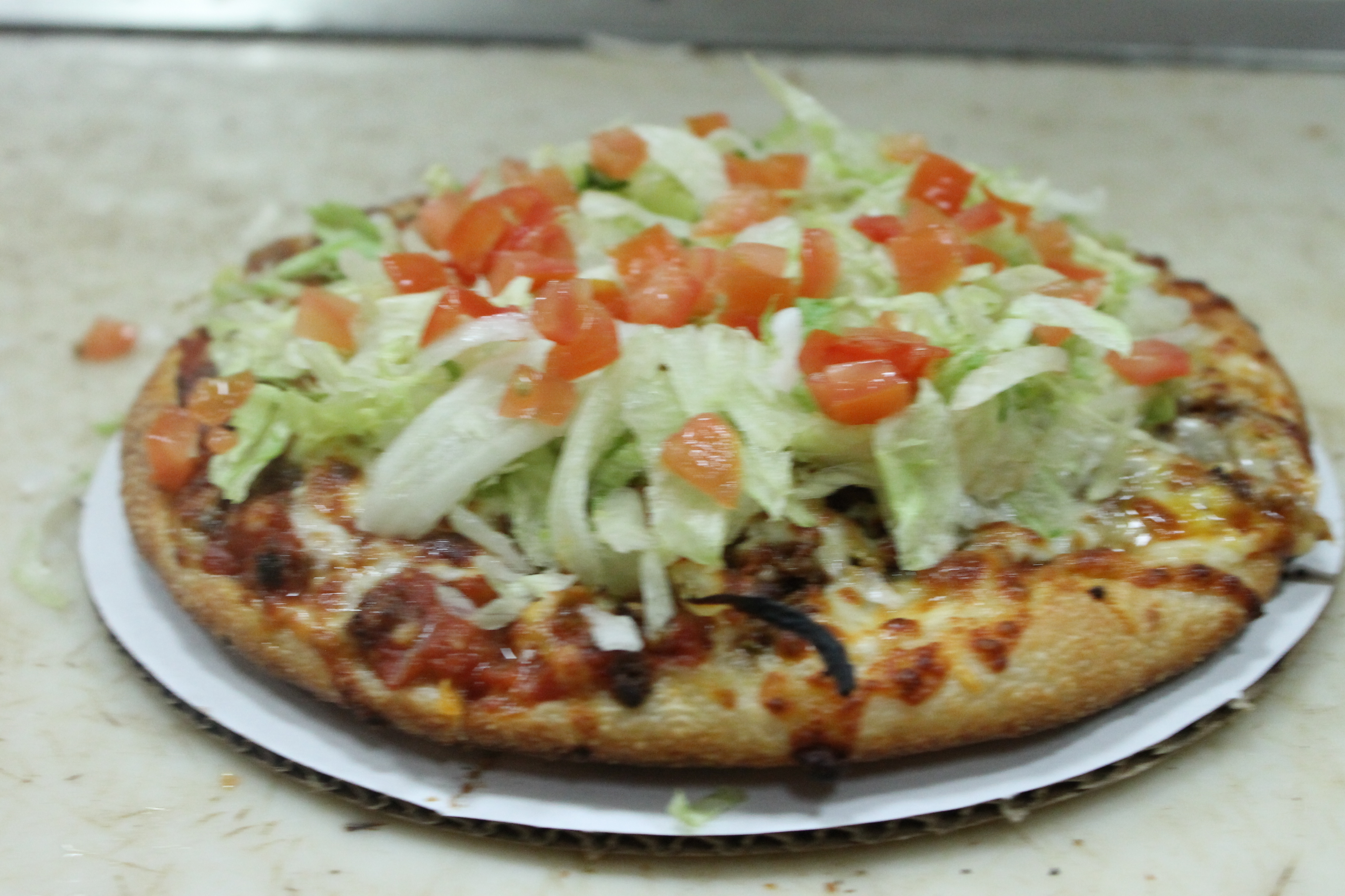 Order Taco Pizza food online from Bellacino's Pizza & Grinders store, Keego Harbor on bringmethat.com
