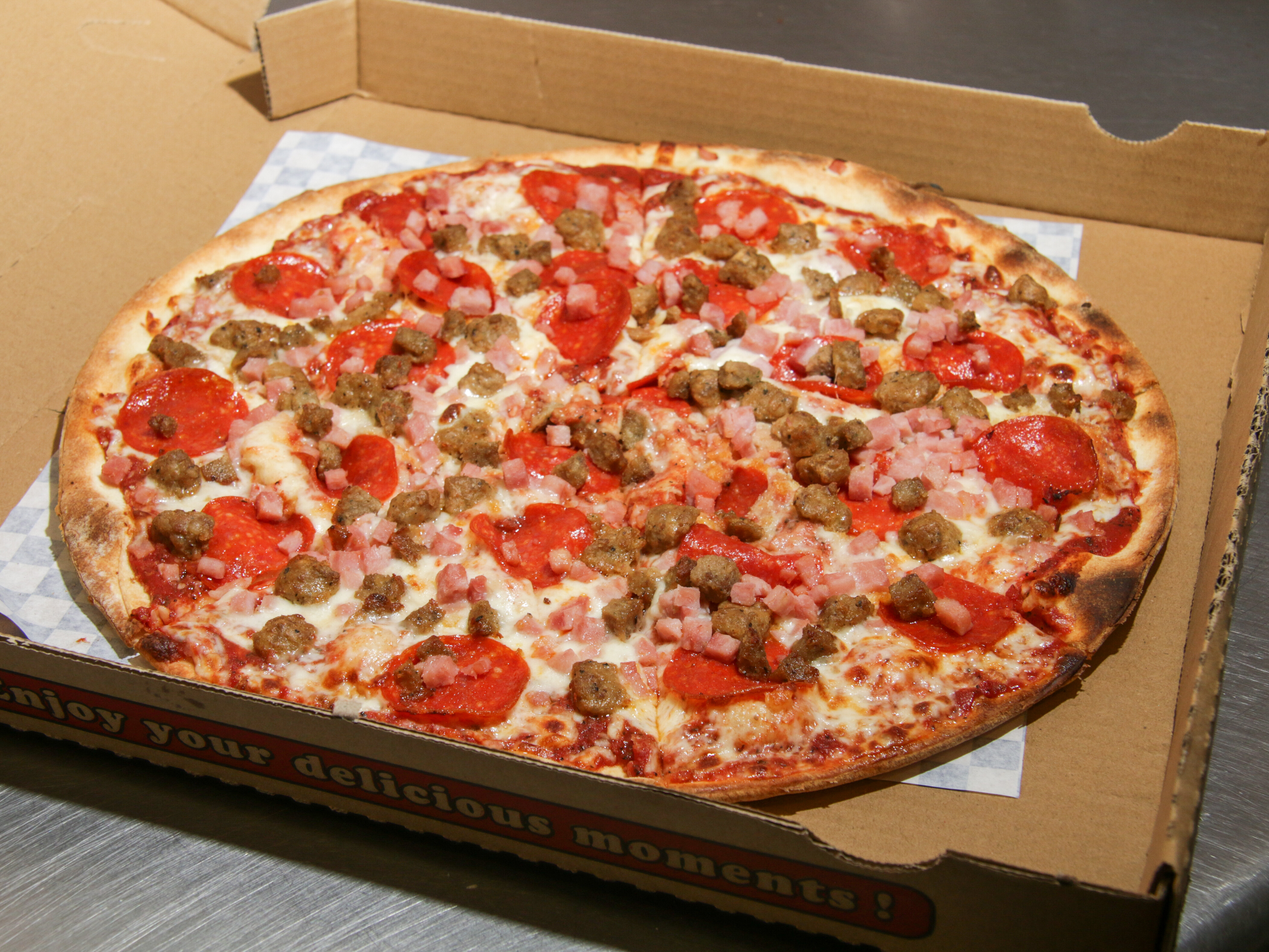 Order Meat Lovers Specialty Pizza food online from Vegas Best Pizza store, Las Vegas on bringmethat.com
