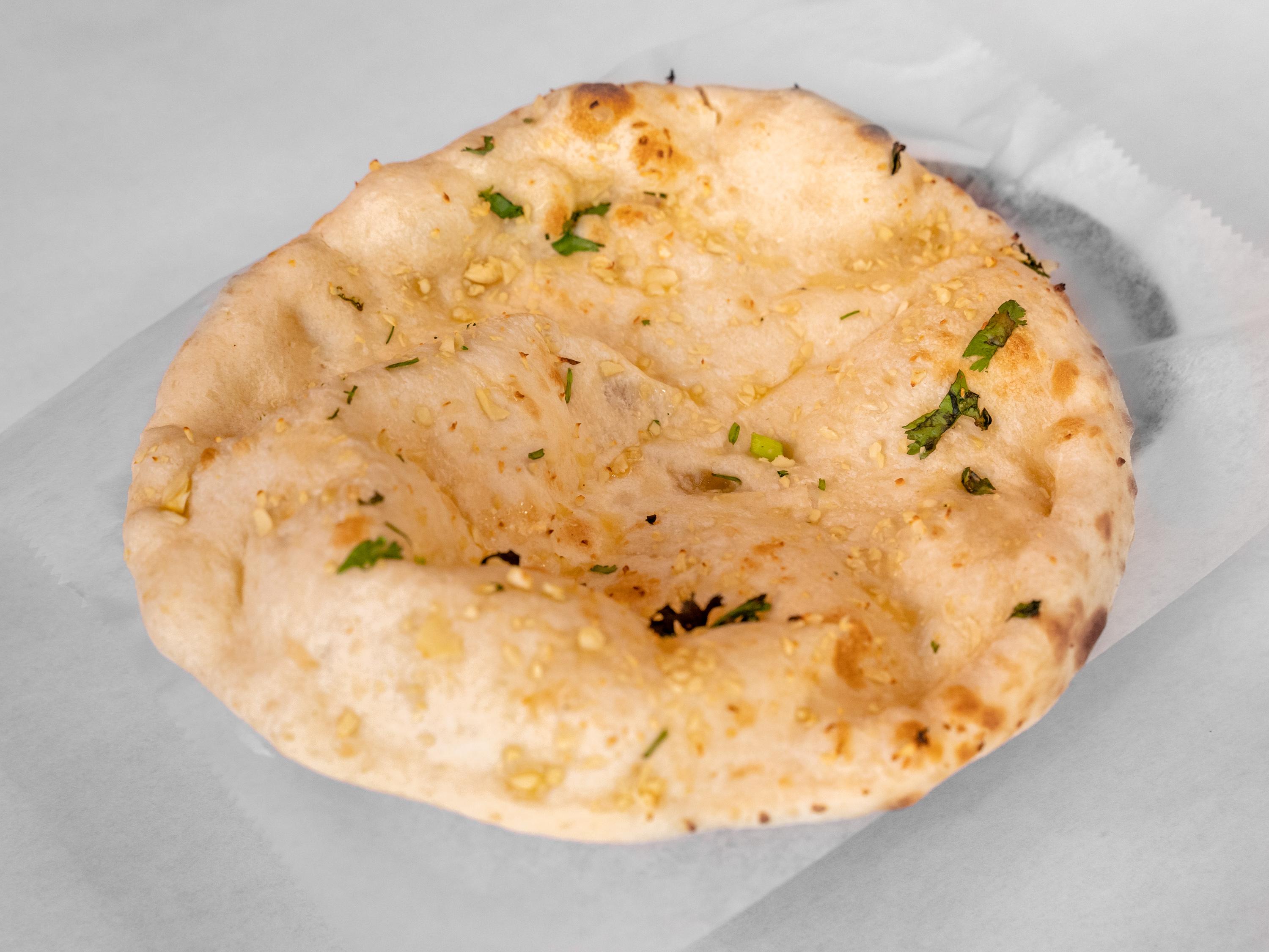 Order Garlic Naan food online from North Indian Restaurant store, Philadelphia on bringmethat.com