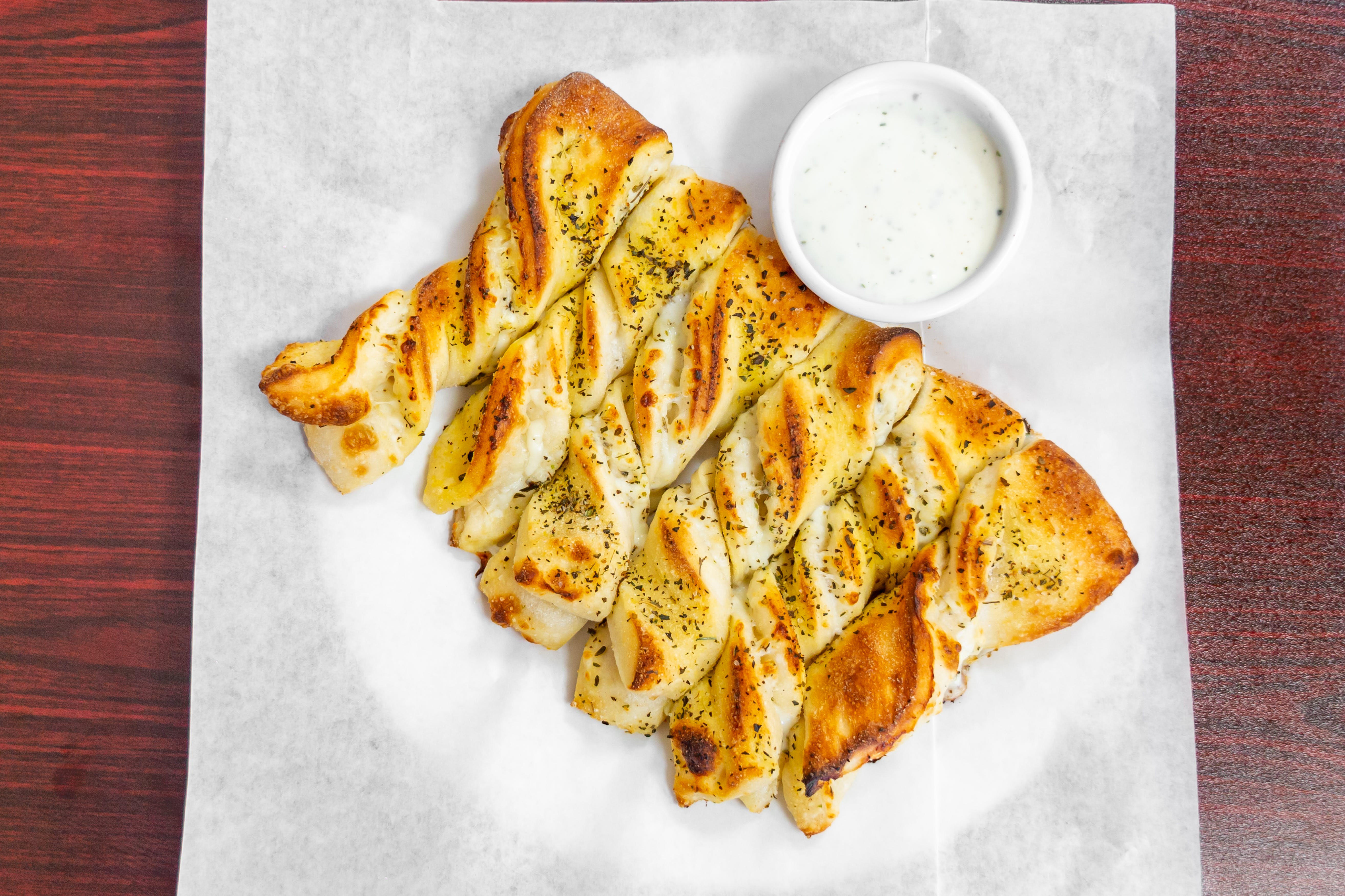 Order Garlic Twists - 6 Pieces food online from Bella Roma Pizza store, Livermore on bringmethat.com