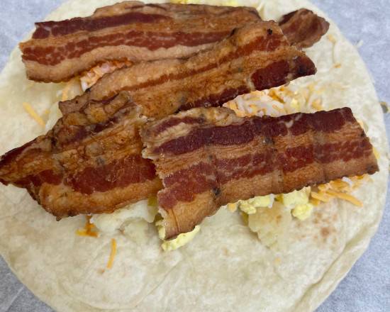 Order Potato, Bacon, Egg, and Cheese Taco food online from Dawn Donuts store, League City on bringmethat.com