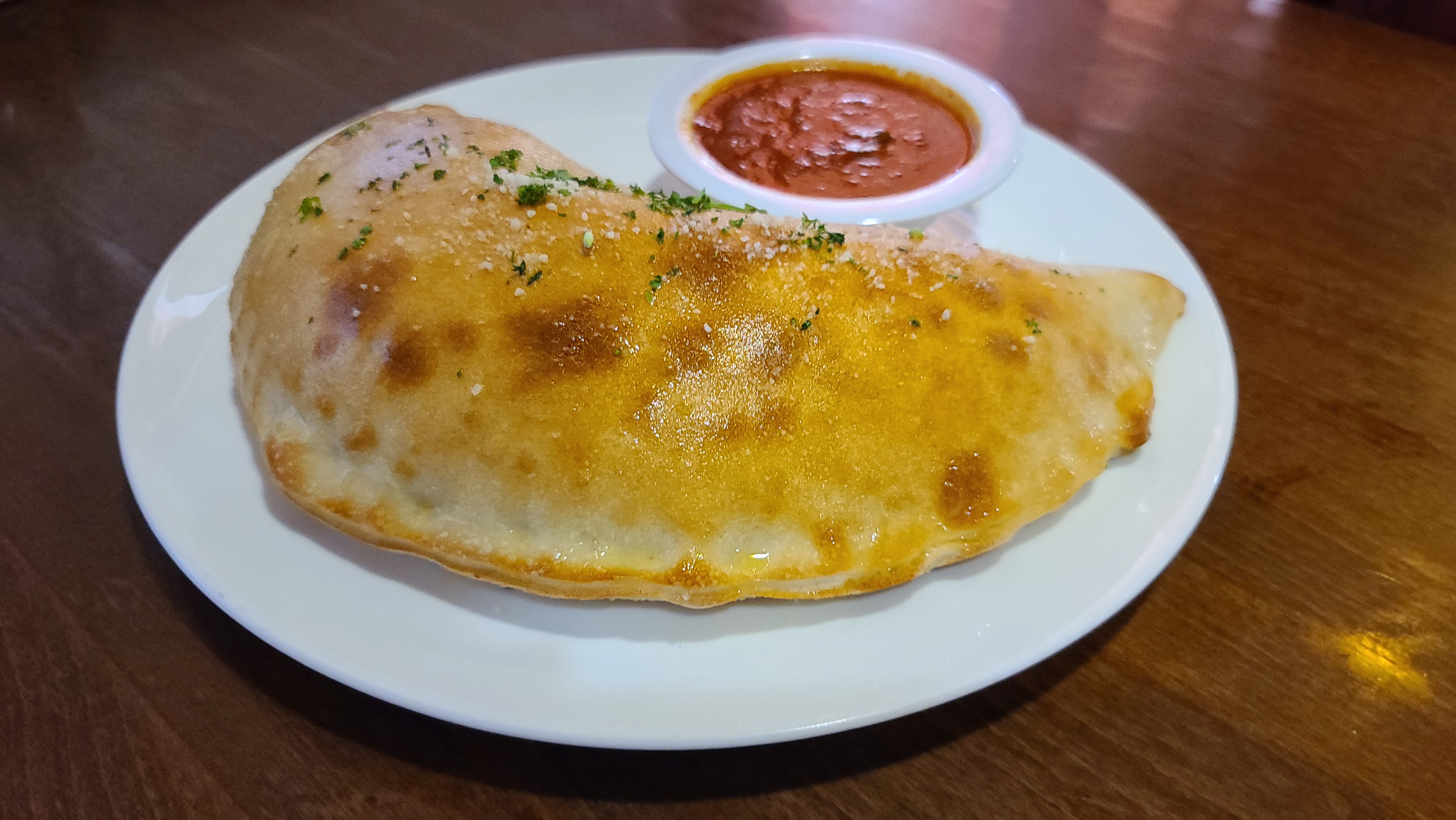 Order Sausage and Cheese Calzone food online from Italian Cafe store, Irving on bringmethat.com