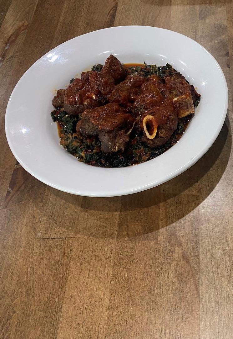Order Efo Riro-Spinach + Goat Meat food online from Fusion Vibes Kitchen + Bar store, Richardson on bringmethat.com