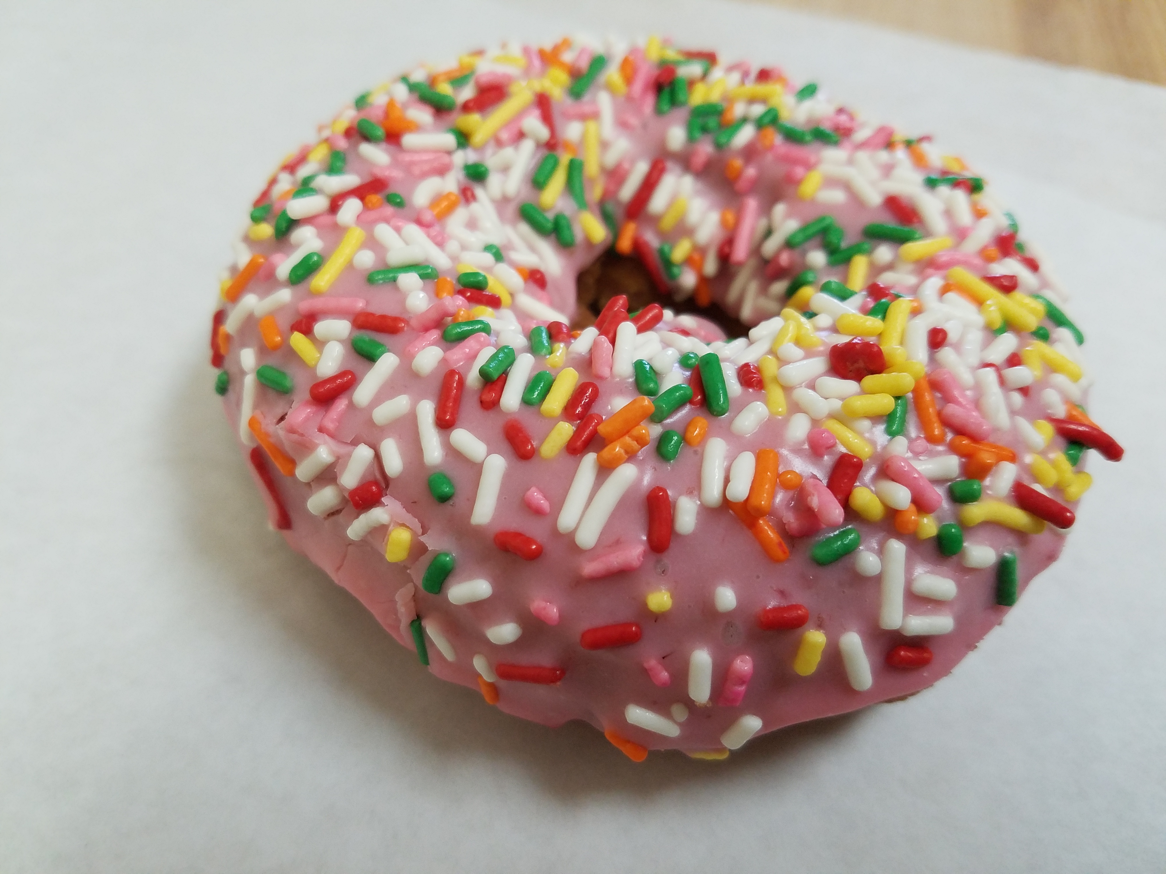 Order Strawberry sprinkle cake donut  food online from O Donuts store, Everett on bringmethat.com
