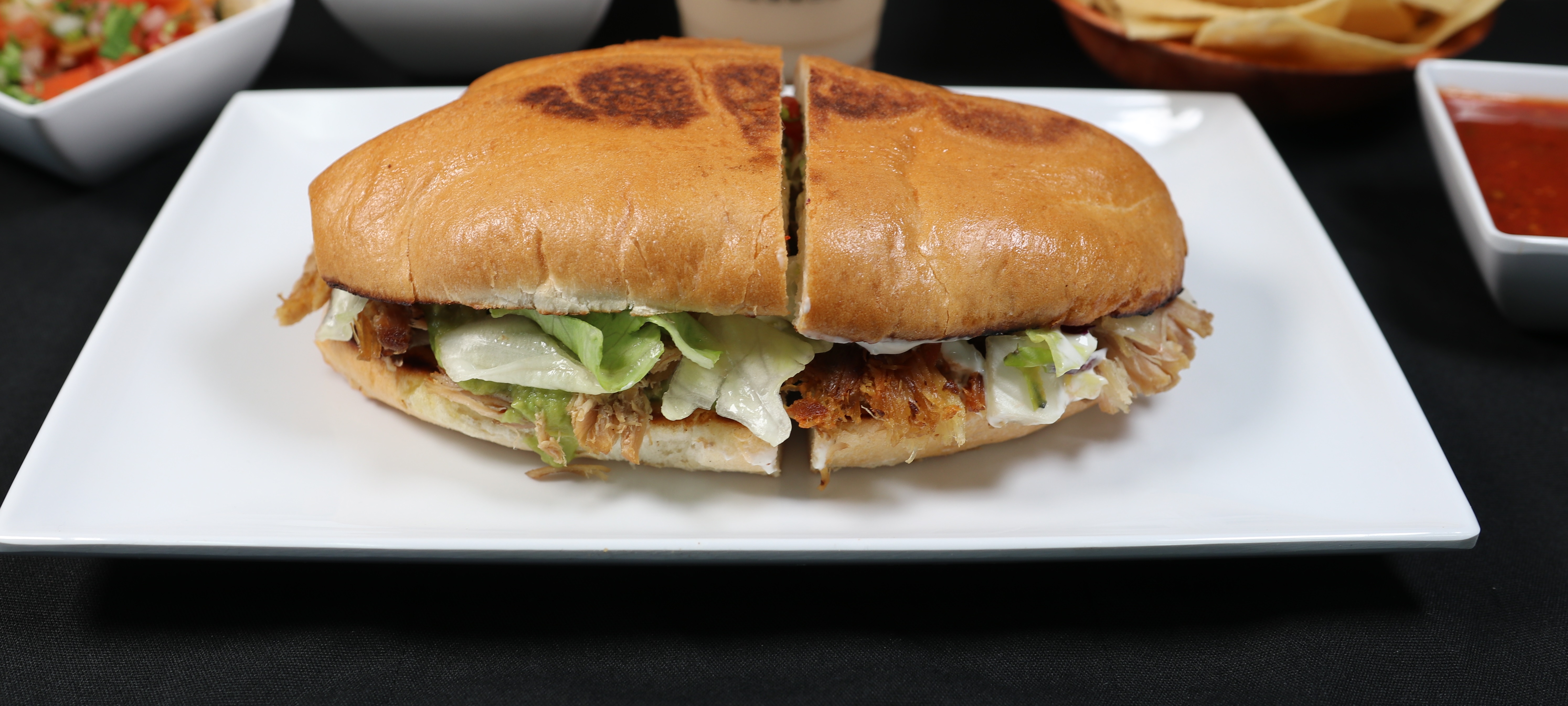 Order Torta Regular food online from Tequila Taqueria store, Livemore on bringmethat.com