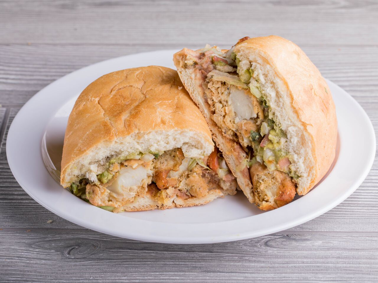 Order Fish Torta food online from Ray Mexican Restaurant store, San Diego on bringmethat.com